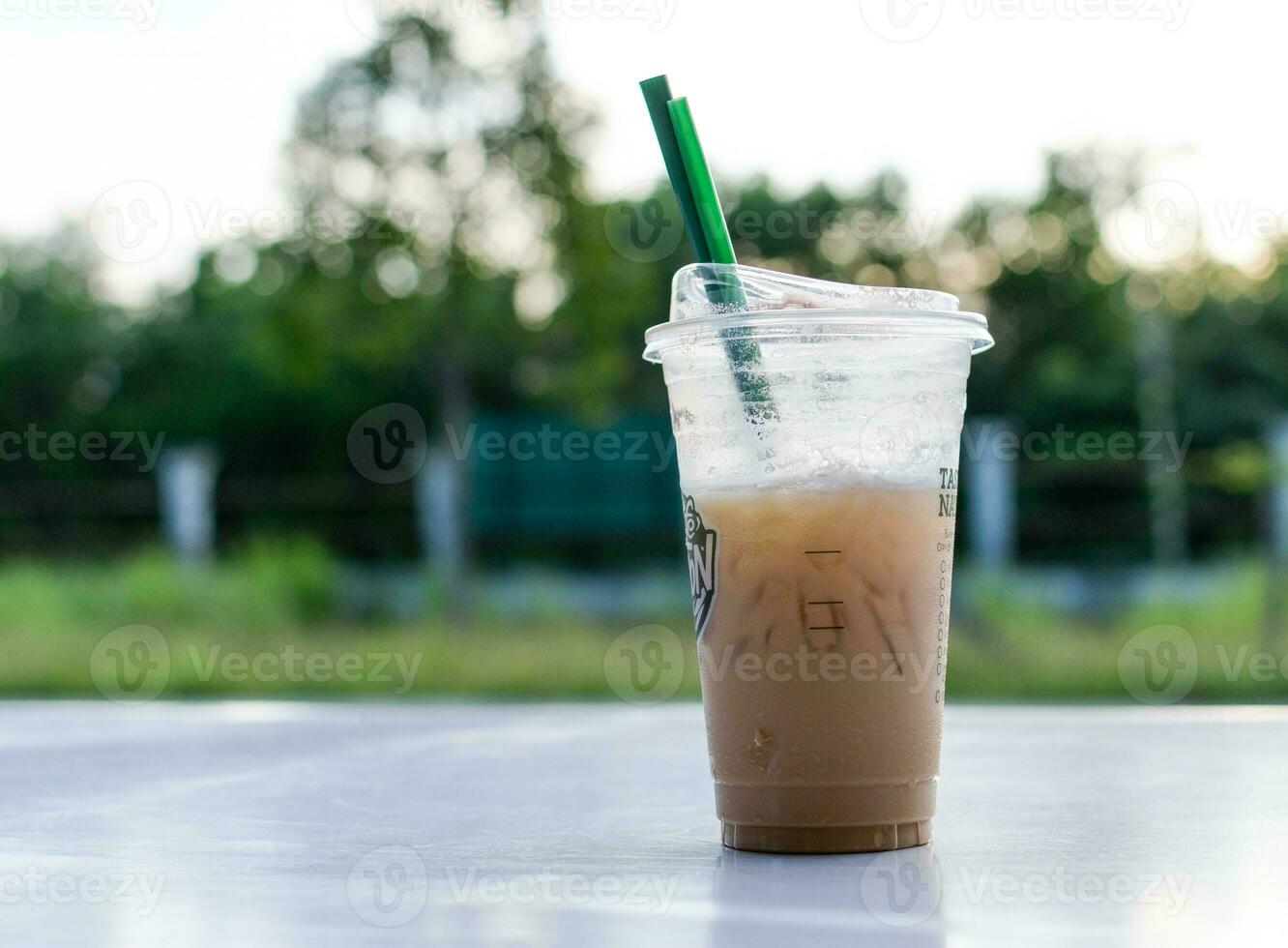 a starbucks iced coffee sitting on a table photo