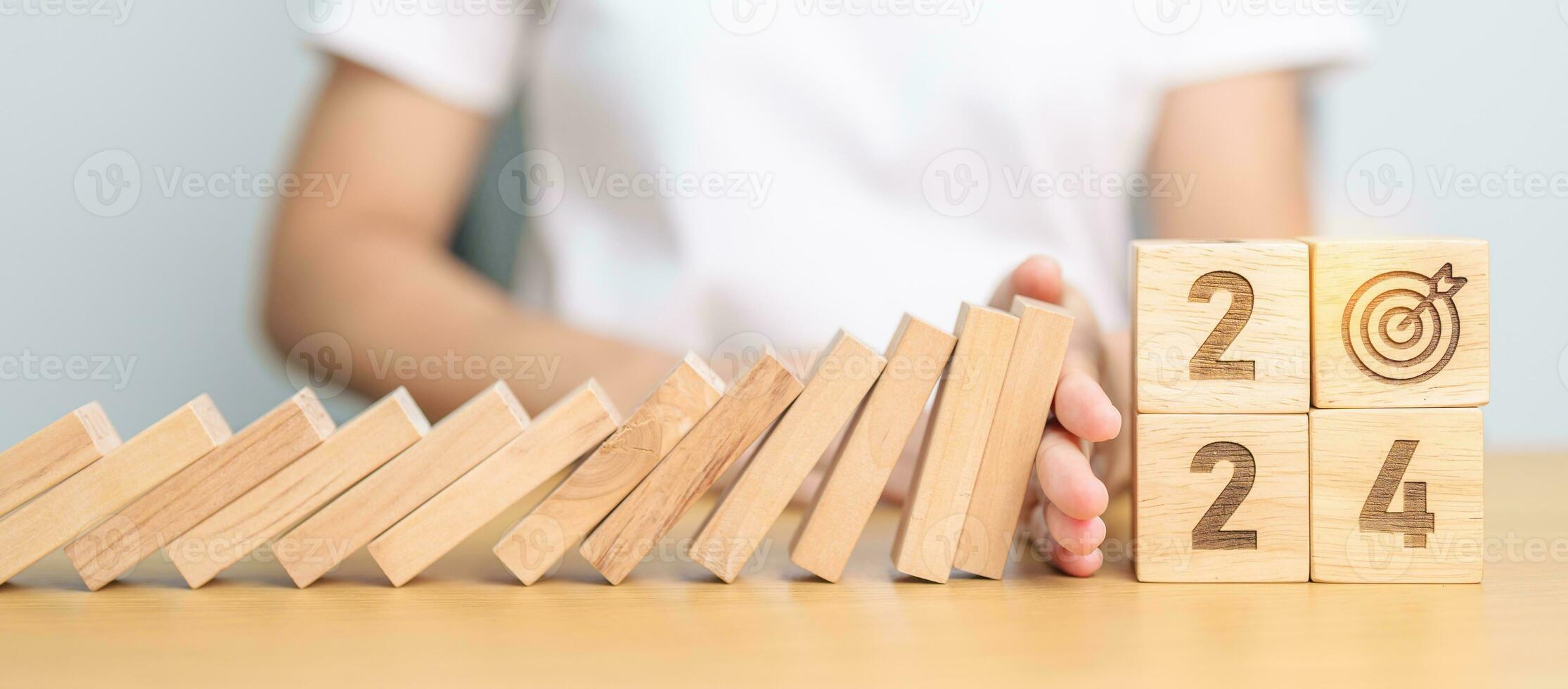 2024 year with falling blocks on table, Risk Management, recession, business financial, Resolution, strategy, goal, New Year planning and inflation economy concepts photo