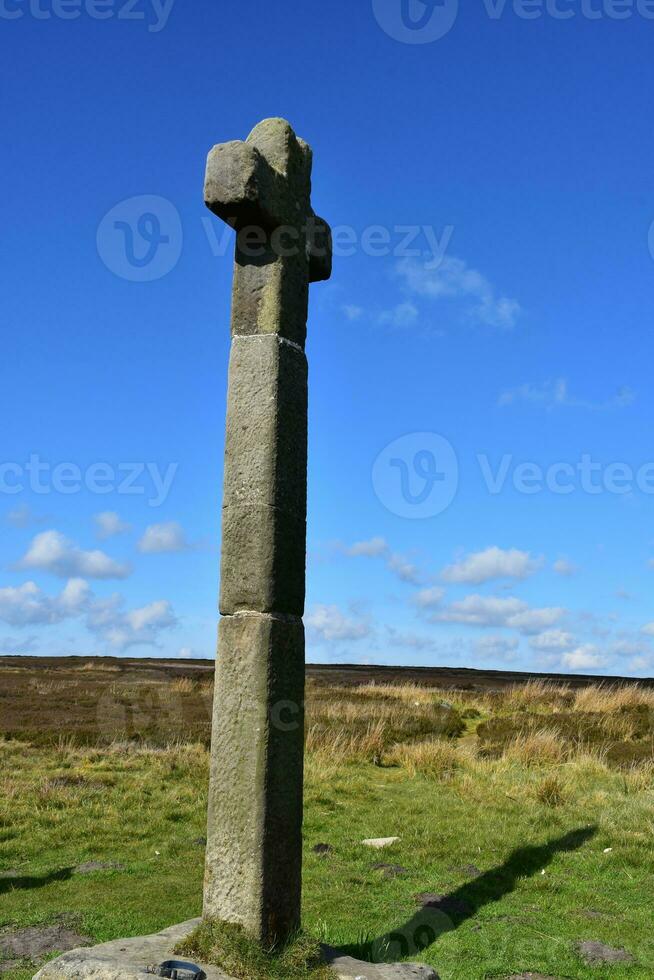 Tall Stone Cross That Acts as a Waymarker on the Moors photo