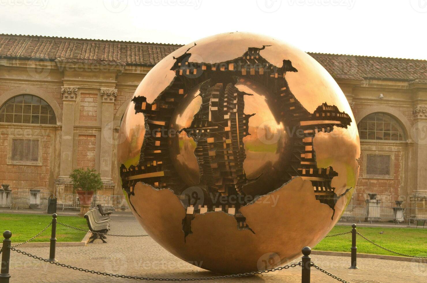 Symbolic statue in vatican city of a large sphere photo