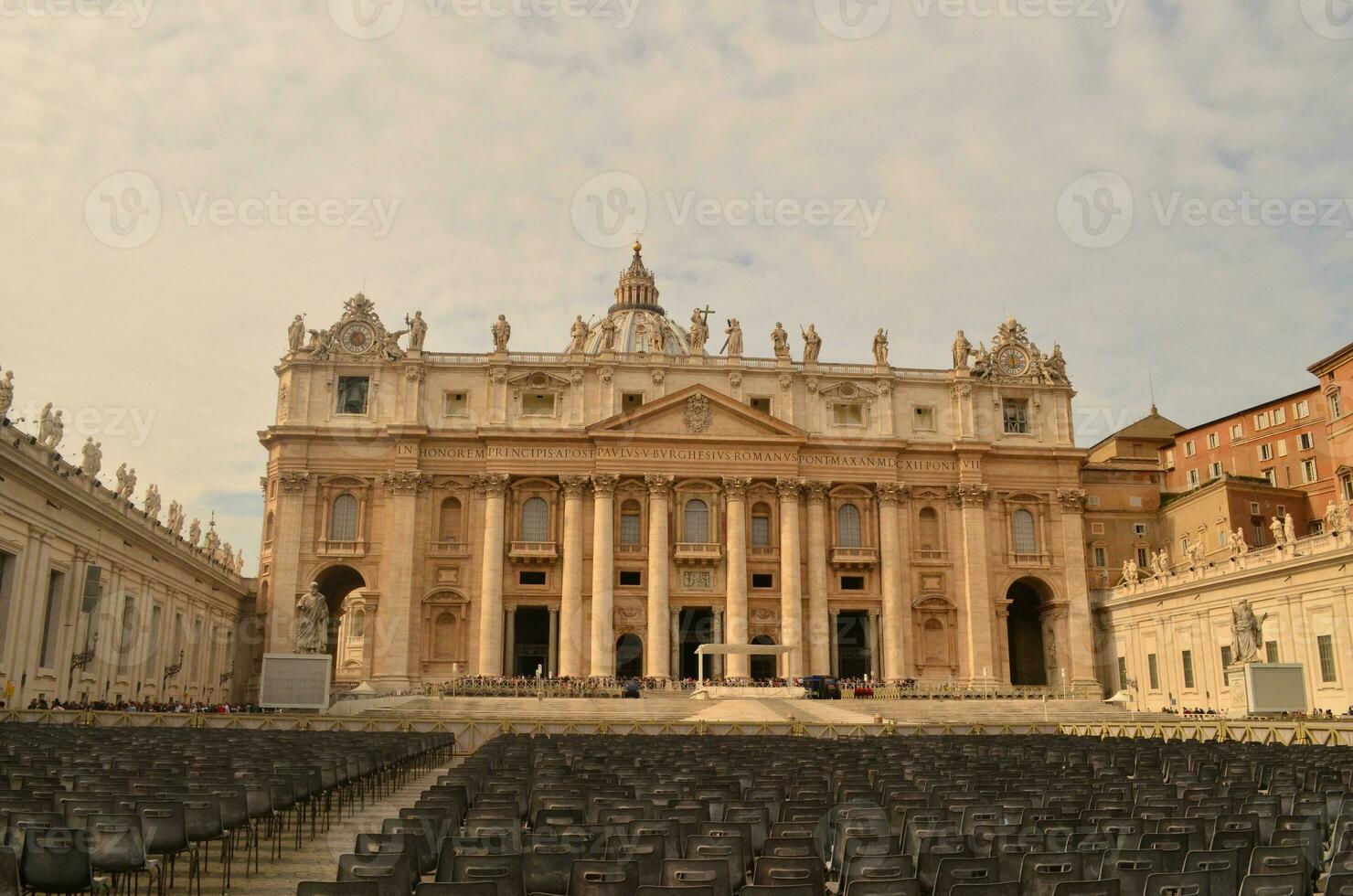 Large number of chairs filling the square in vatican city photo