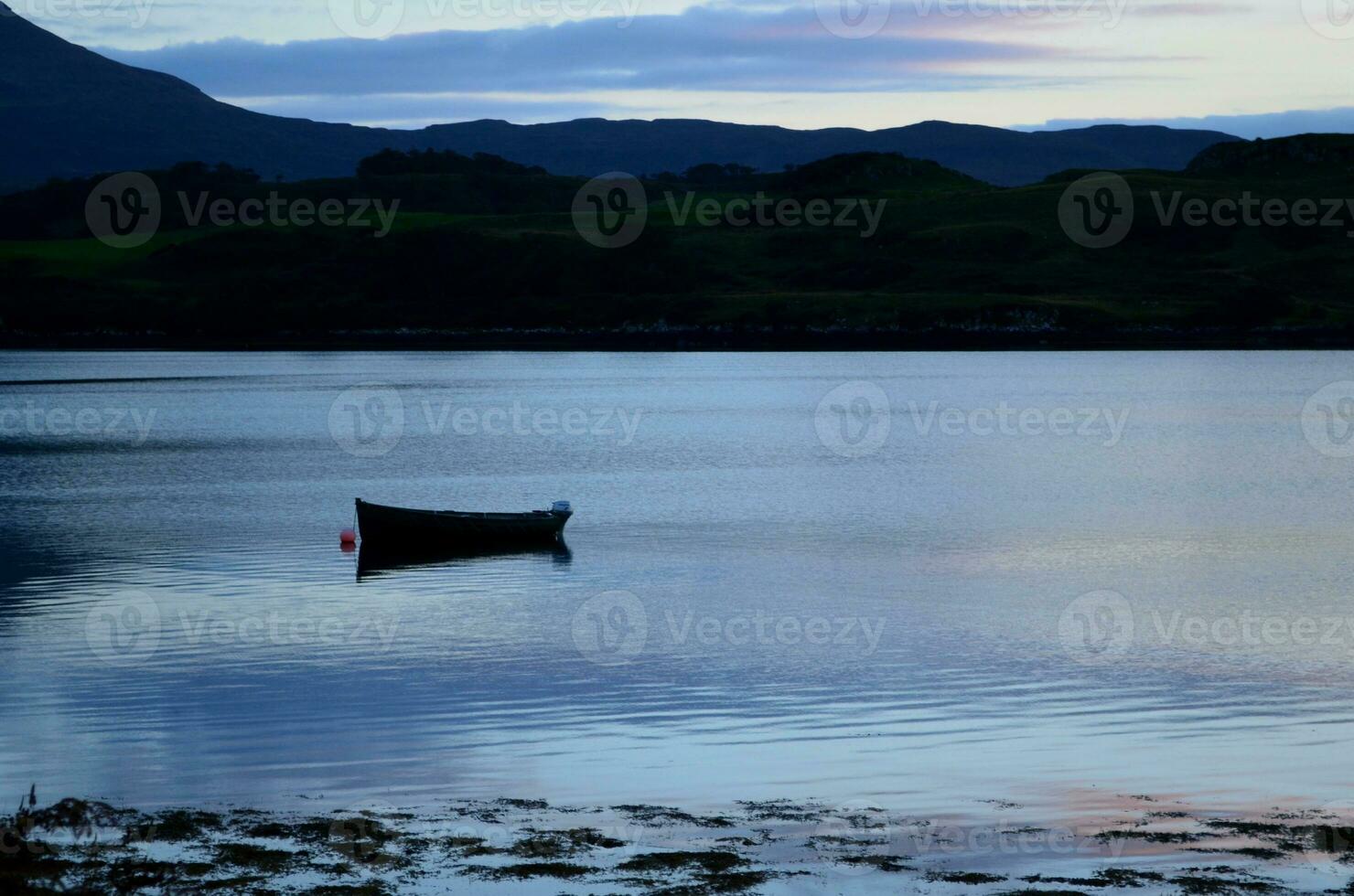 Silhouetted Dingy on Loch Dunvegan photo