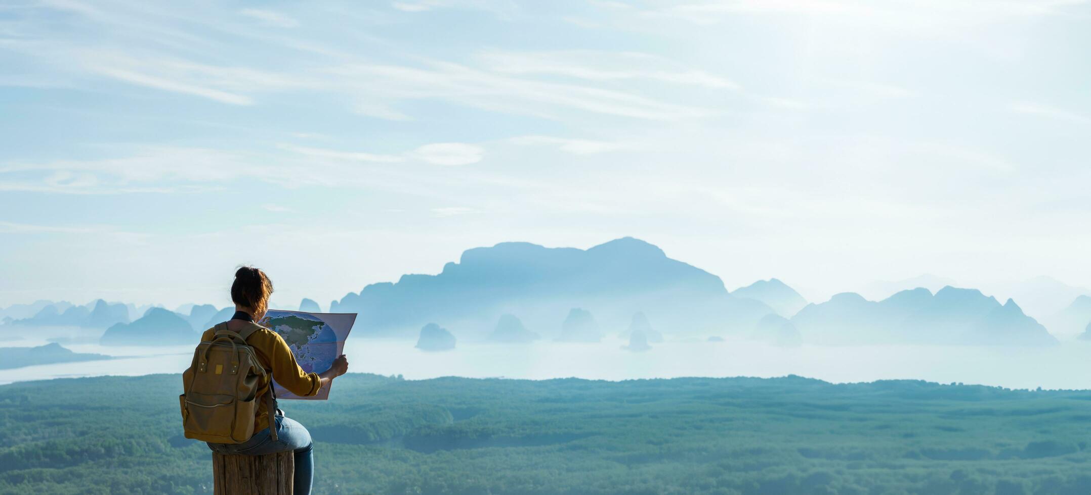 Travelers, young women are exploring the map. Landscape Beautiful Mountain on sea at Samet Nangshe Viewpoint. Phang Nga Bay ,Travel adventure, Travel Thailand, Tourist on summer holiday vacation. photo