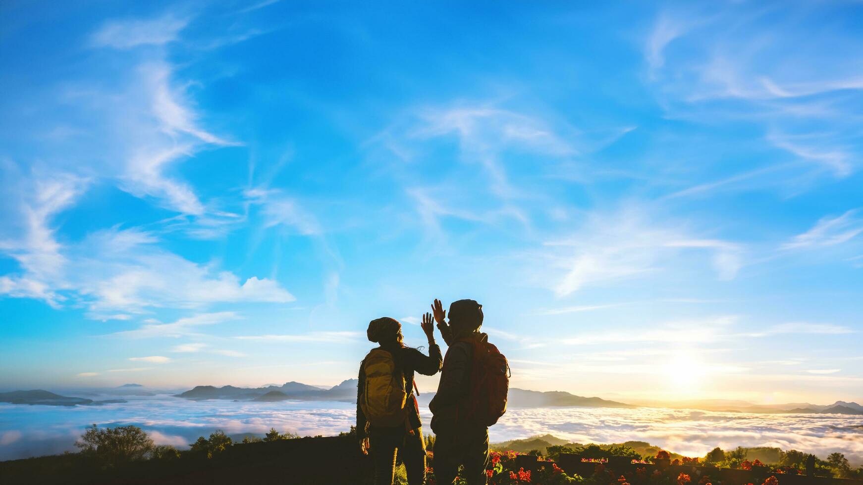 Asian couples Tourists with backpacks travel nature on the mountain,Travel relax. Natural Touch countryside. Thailand photo