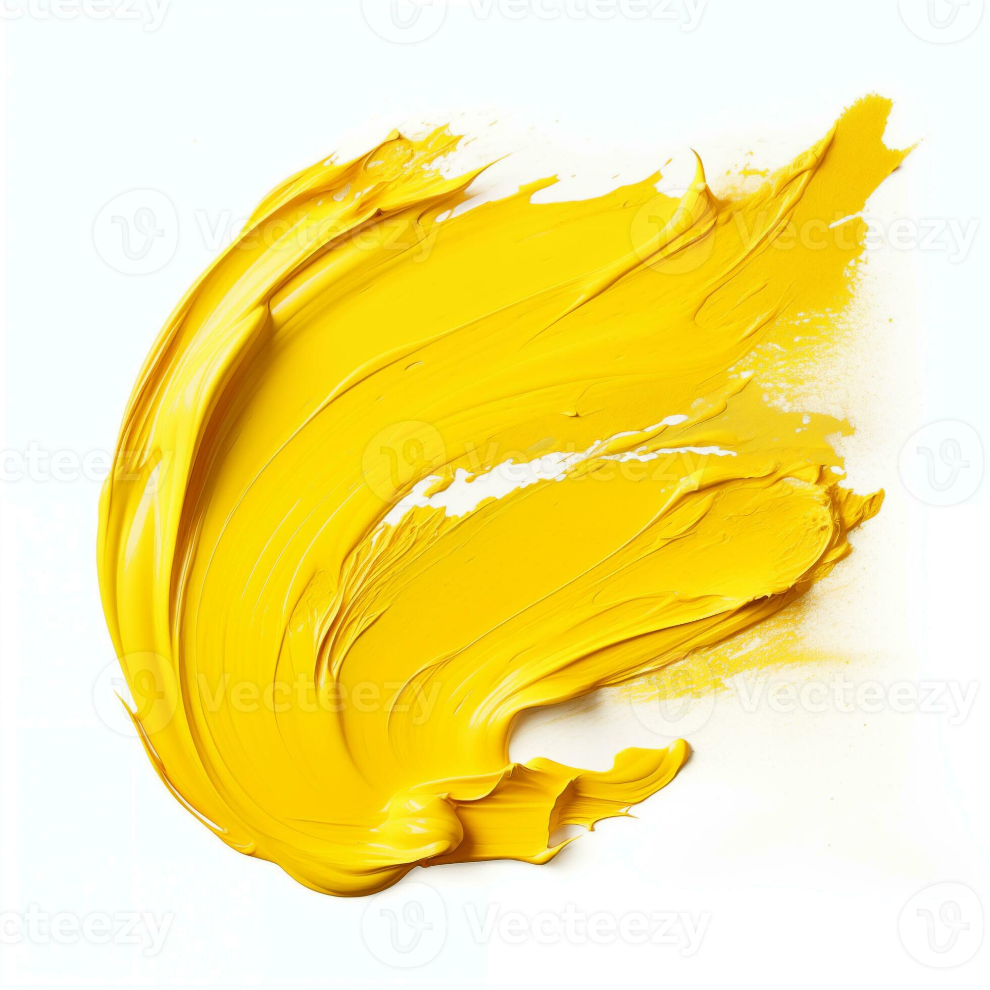A smear of yellow acrylic paint. A brush stroke of paint on a white