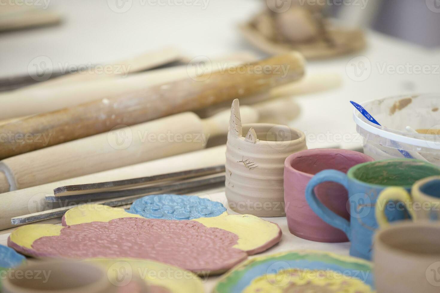 Clay products in the workshop on the table. Clay modeling master class. photo