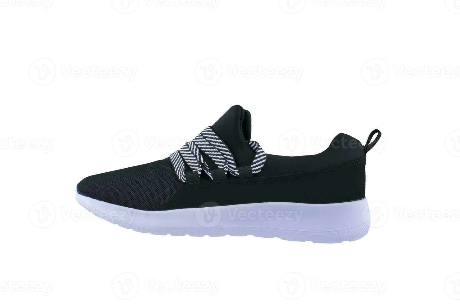 Sneaker. Sports shoes side view on a white background.Black shoe with white sole photo