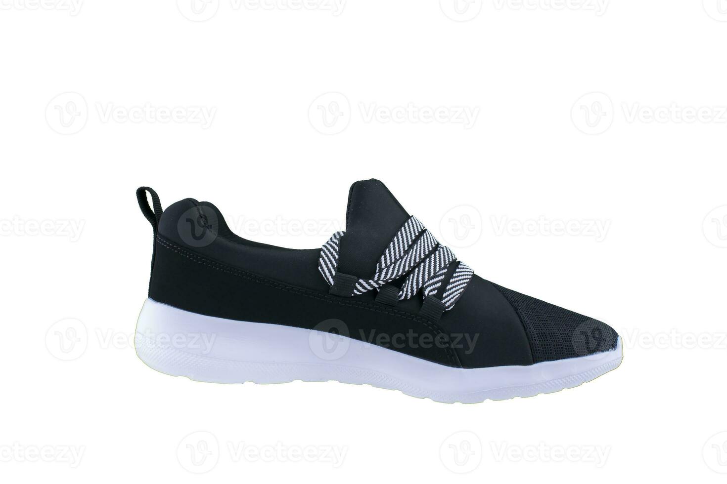 Sneaker. Sports shoes side view on a white background.Black shoe with white sole photo