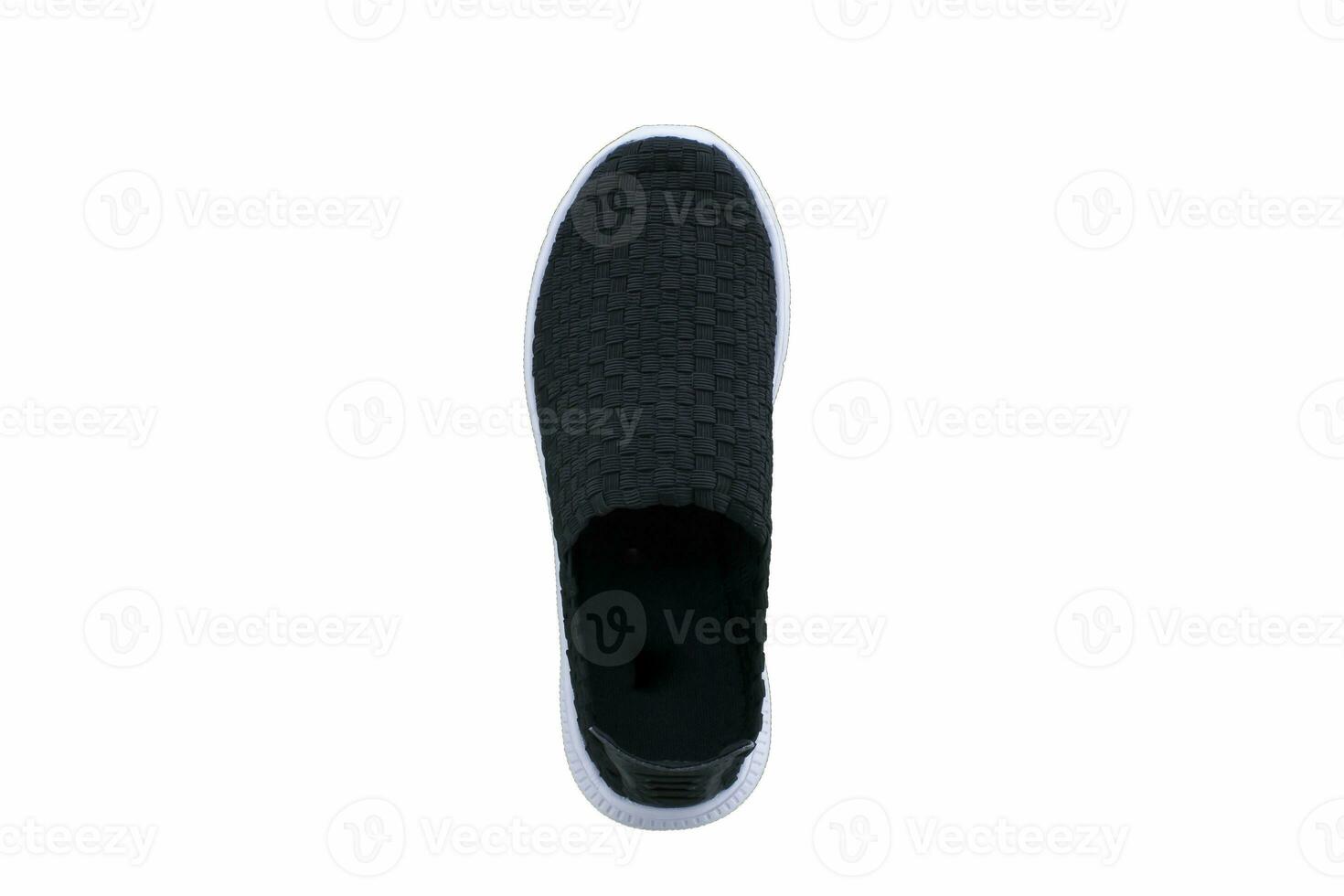 Black sneakers on white soles. Sport shoes on a white background. photo