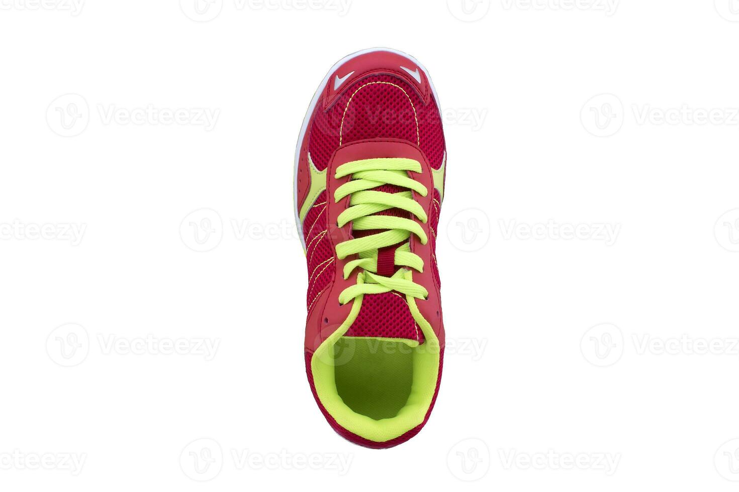 Red sneaker with green laces on a white sole. Sport shoes on white background photo