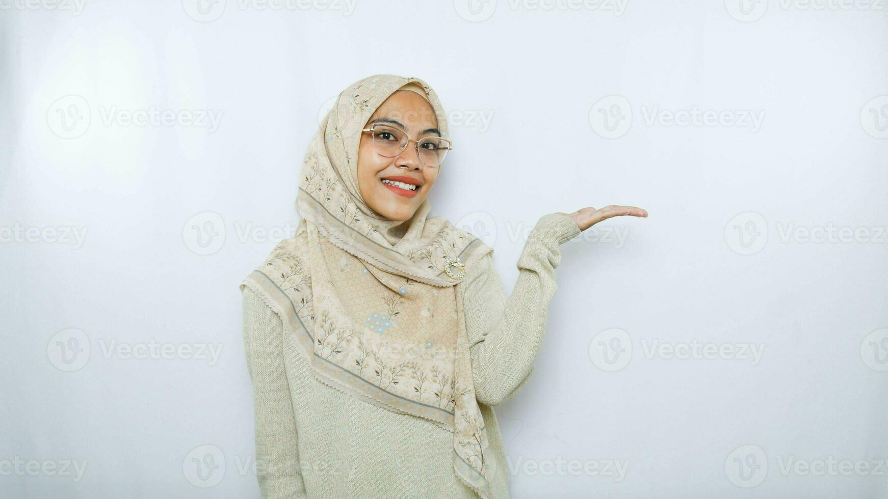 happy young asian woman in casual shirt. Charming female lady open hands palm up holding something on isolated White background. photo