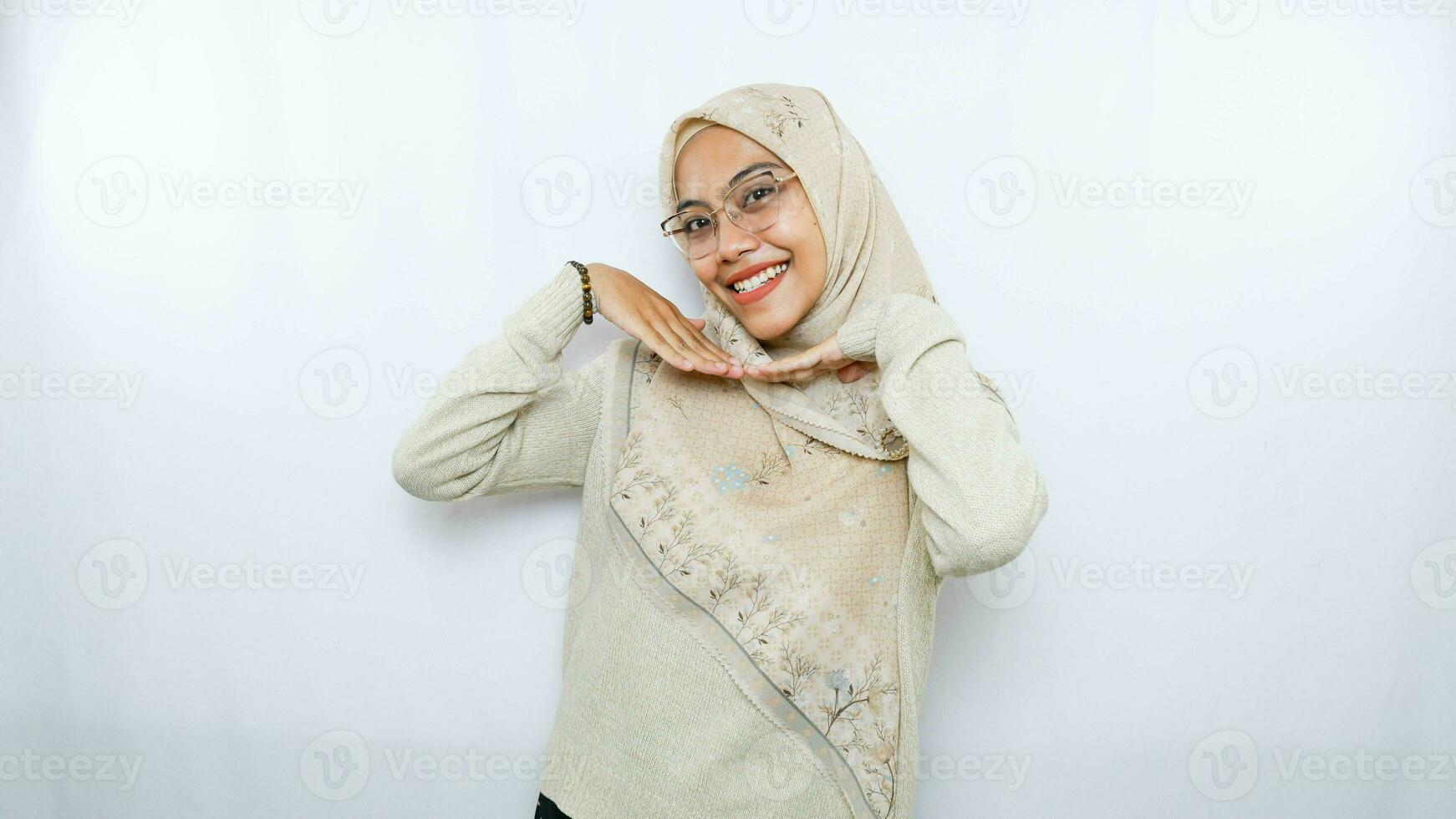 portrait of happy young asian woman wearing hijab isolated on white background photo