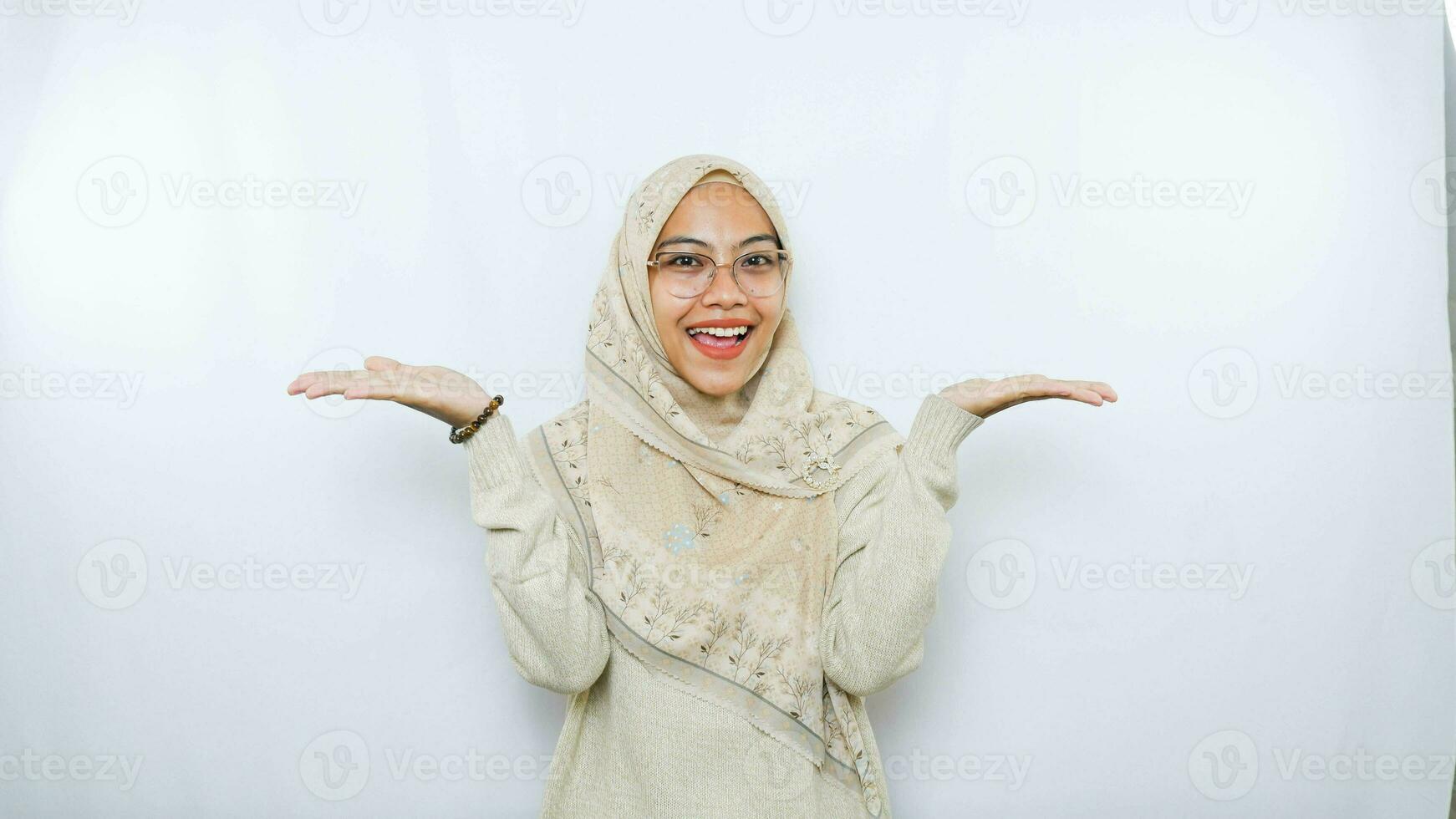 happy young asian woman in casual shirt. Charming female lady open hands palm up holding something on isolated White background. photo