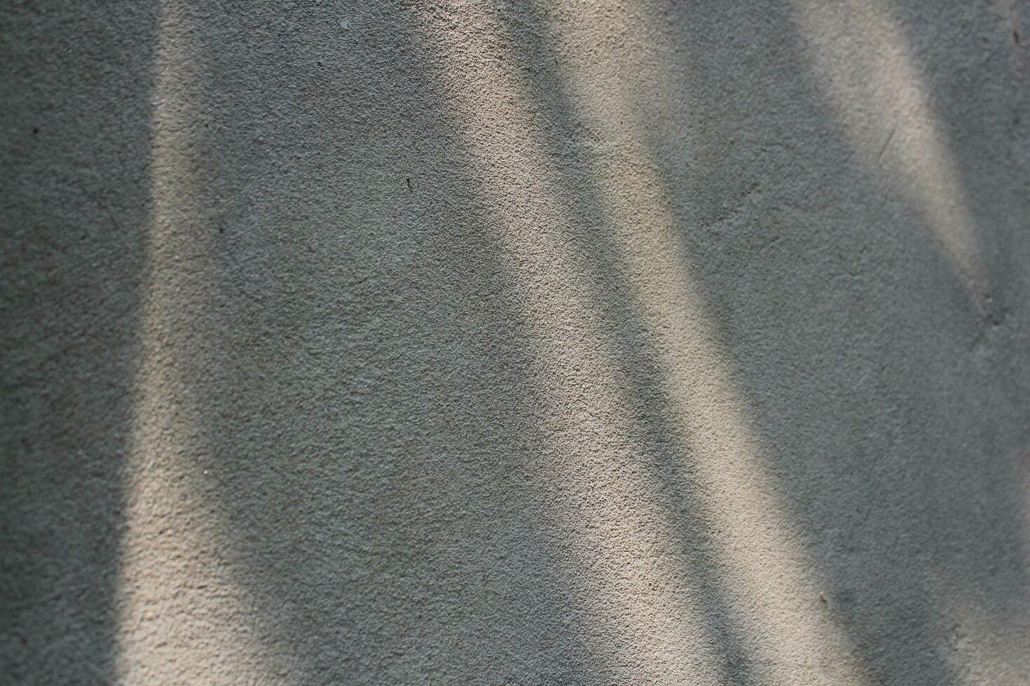 Cement and brick wall texture background, sun rays on the cement wall surface, smooth cement wall backdrop photo
