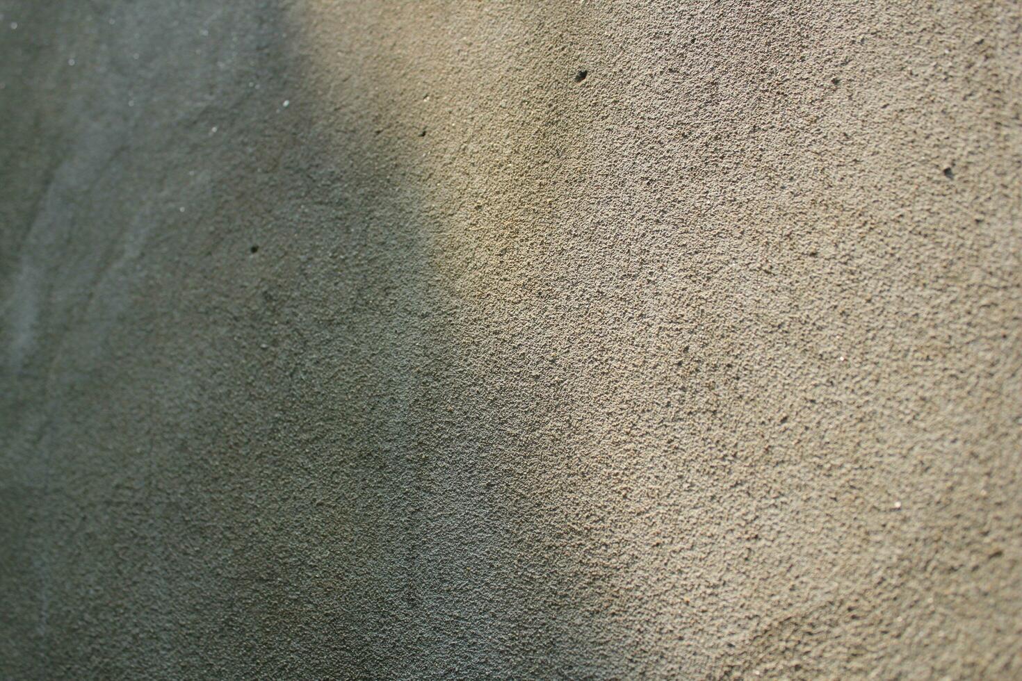 Cement and brick wall texture background, sun rays on the cement wall surface, smooth cement wall backdrop photo