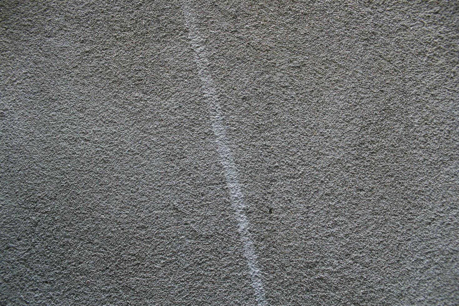 Sun shining on a cement wall background, grungy shiny wall surface, rusty cement wall backdrop photo