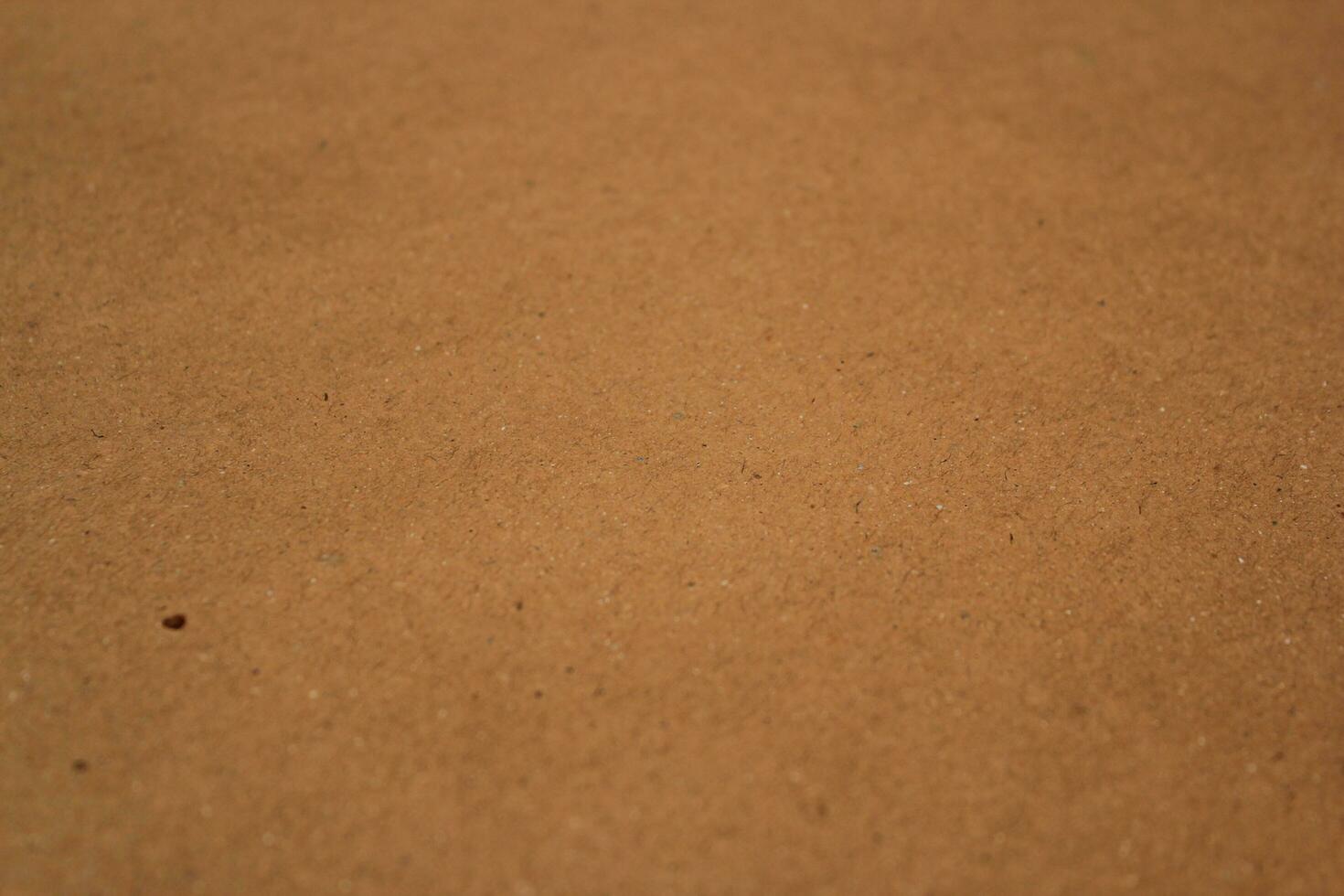 Shiny brown paper texture background, sun rays on the paper surface backdrop photo