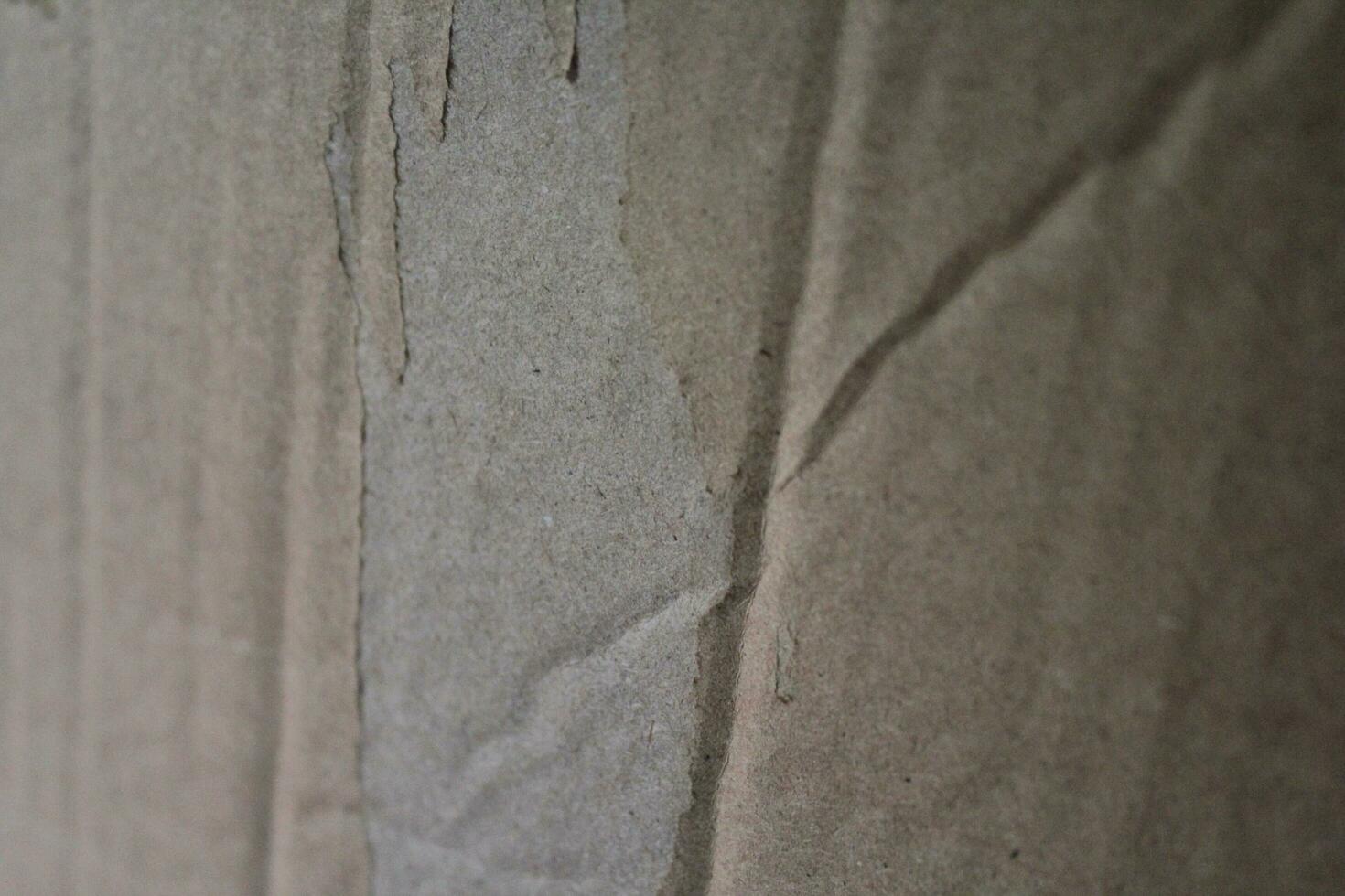 Torn paper background with details, Grungy brown paper surface, rustic paper texture photo