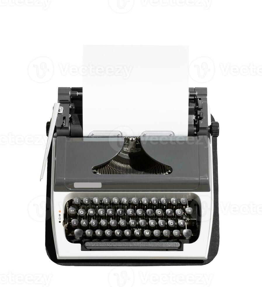 Retro typewriter with empty page. Isolated on white photo