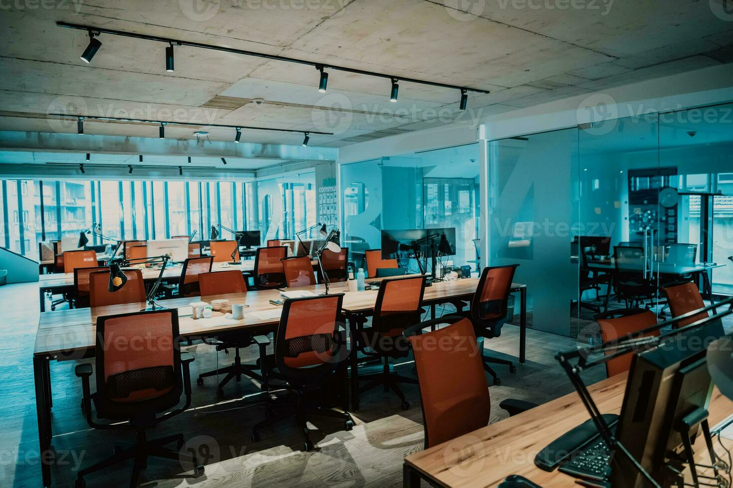 an office with many desks and chairs photo