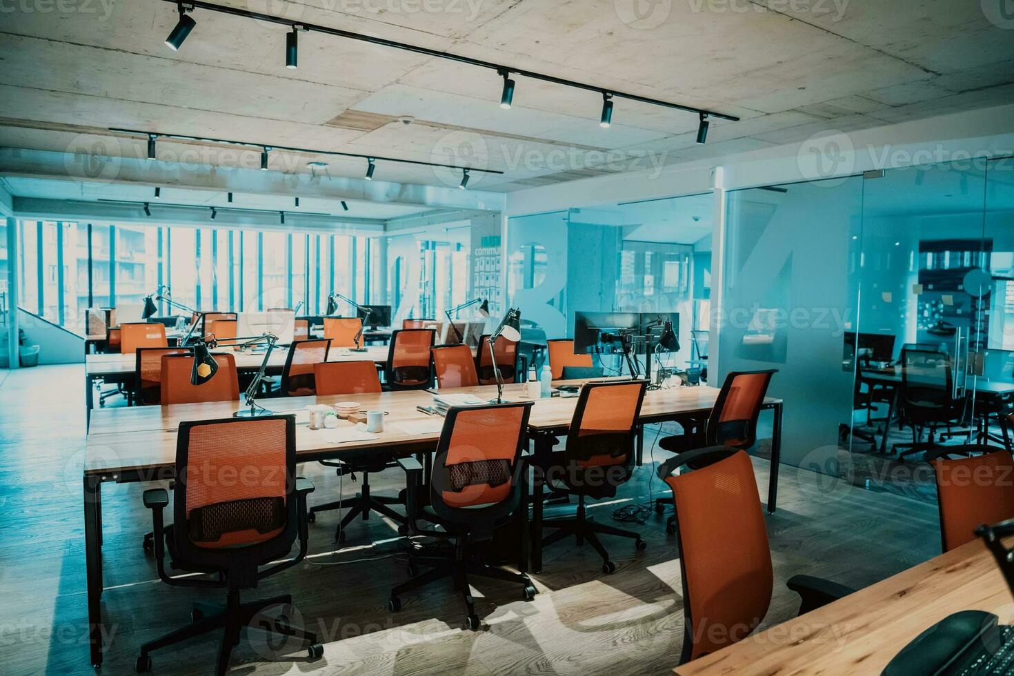 an office with many desks and chairs photo