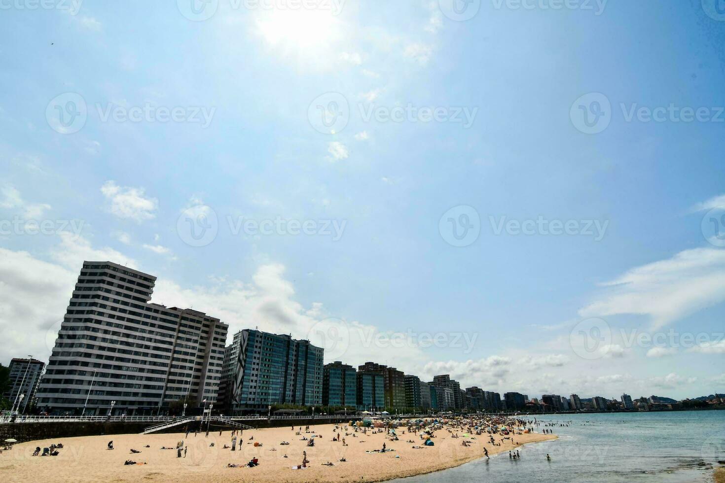 A view of a beach and a city photo