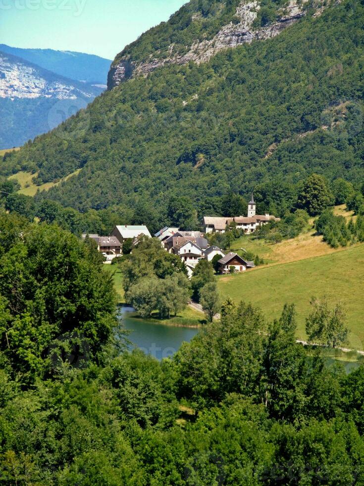 Springtime Serenity Vue Lake and Bauges Mountains, Savoie, France photo