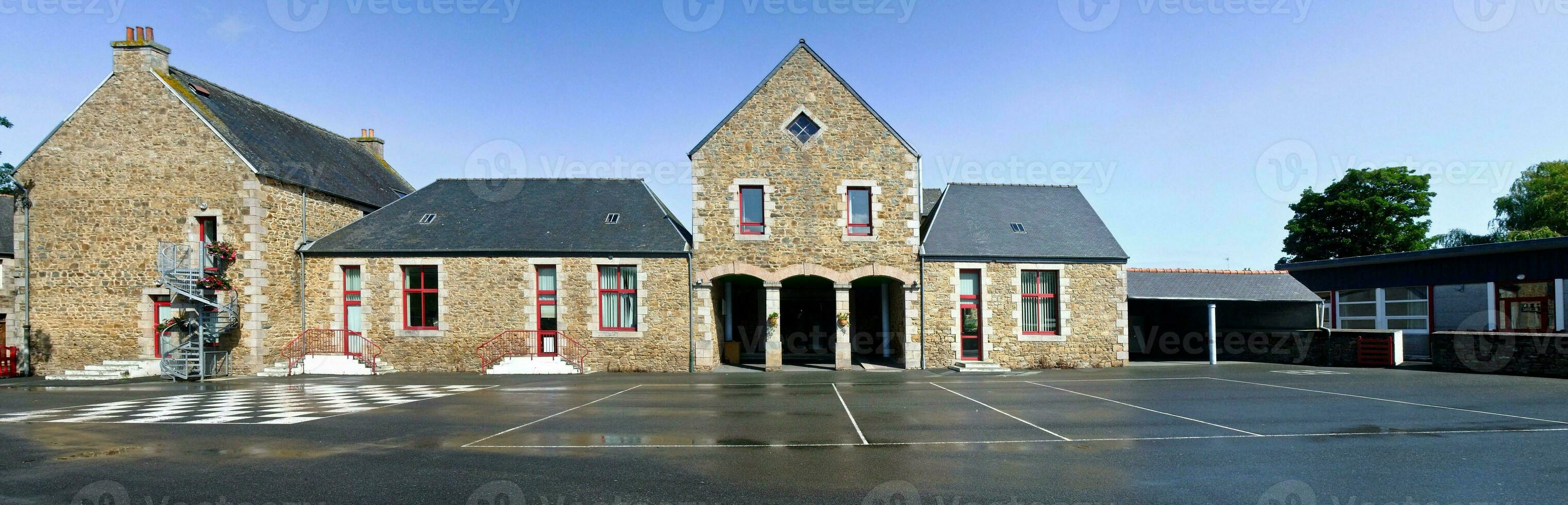 Ancient and Beautiful Primary School in Louannec, Brittany, France   Exterior View photo