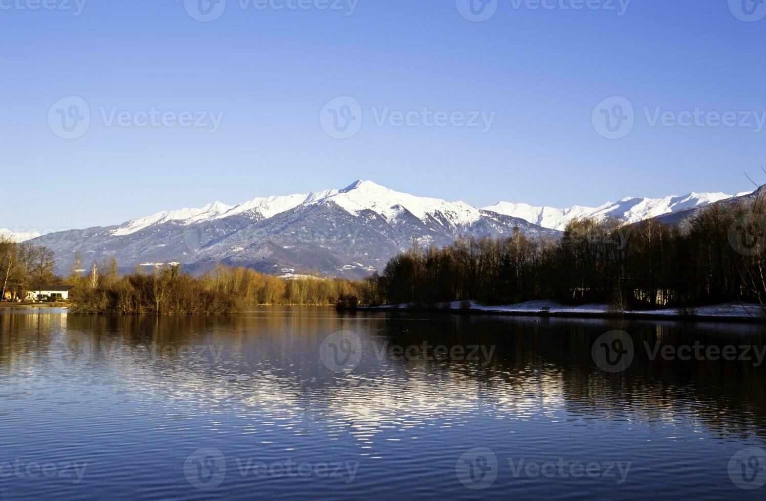 Savoie Splendor Serene Lake and Majestic Mountains in Saint Pierre d'Albigny, France photo