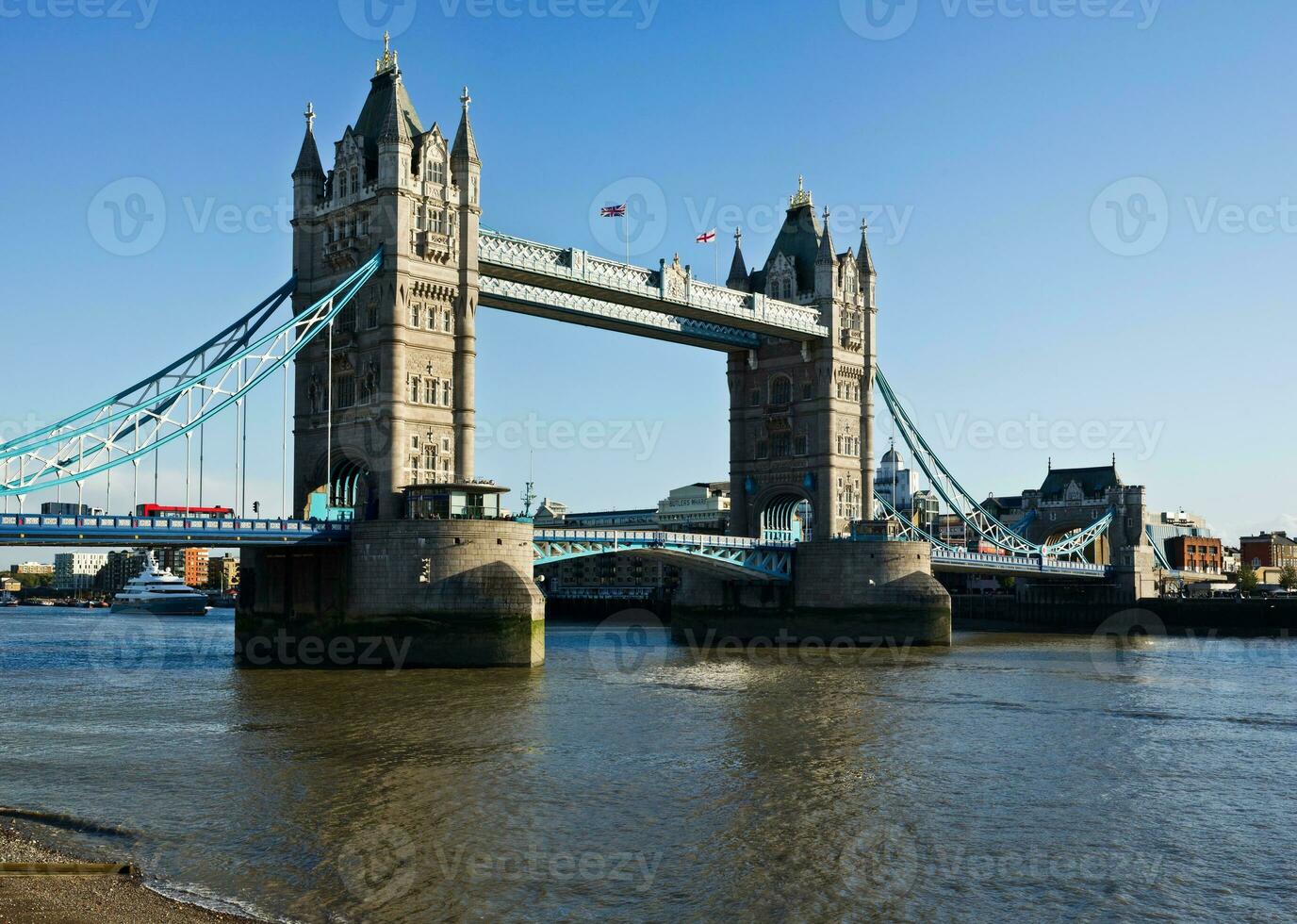 London  Iconic Tower Bridge A Stunning Reflection on a Sunny Thames Day photo