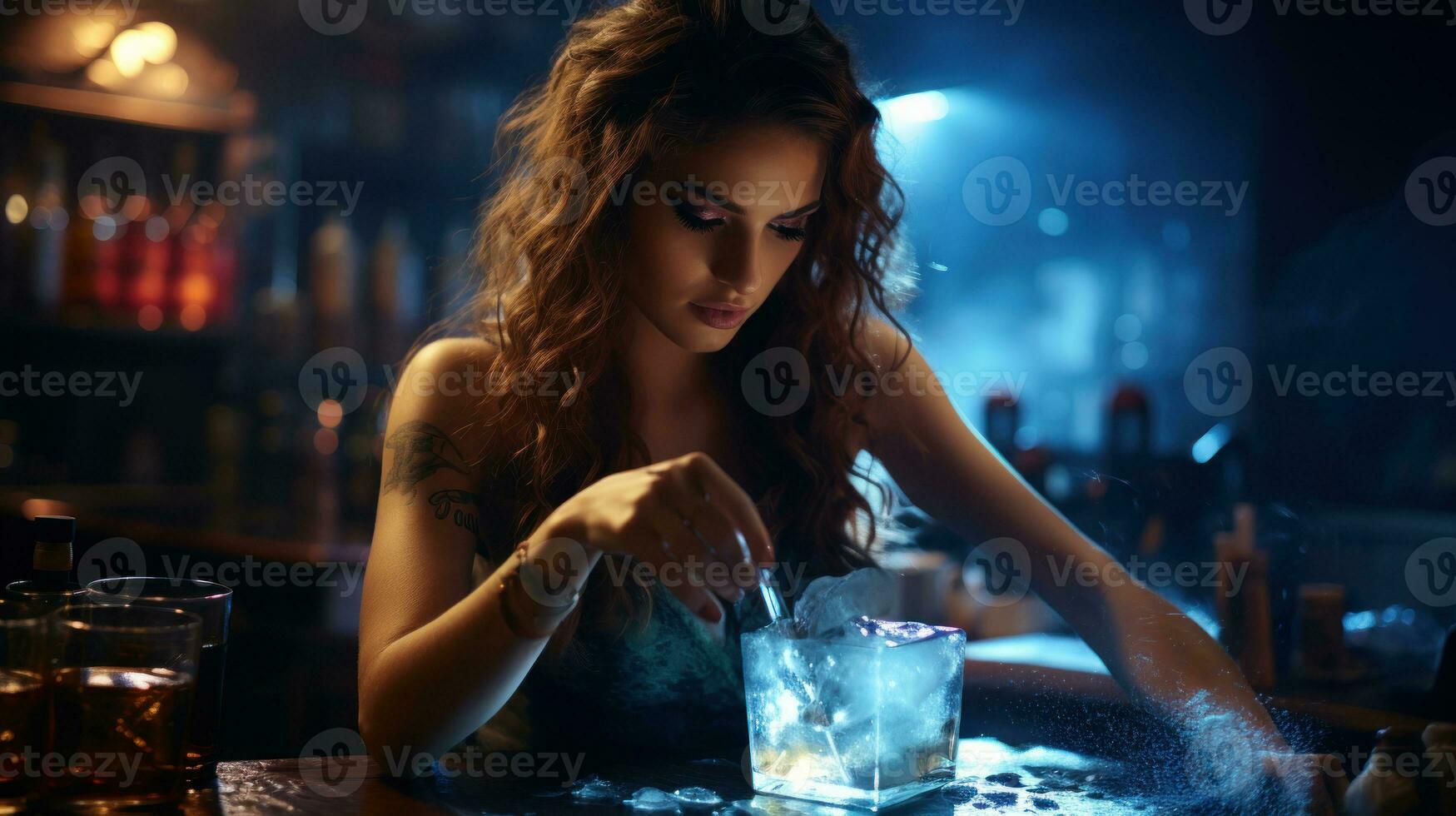 Portrait of beautiful young woman with long curly hair sitting at bar counter and making blue cocktail. photo