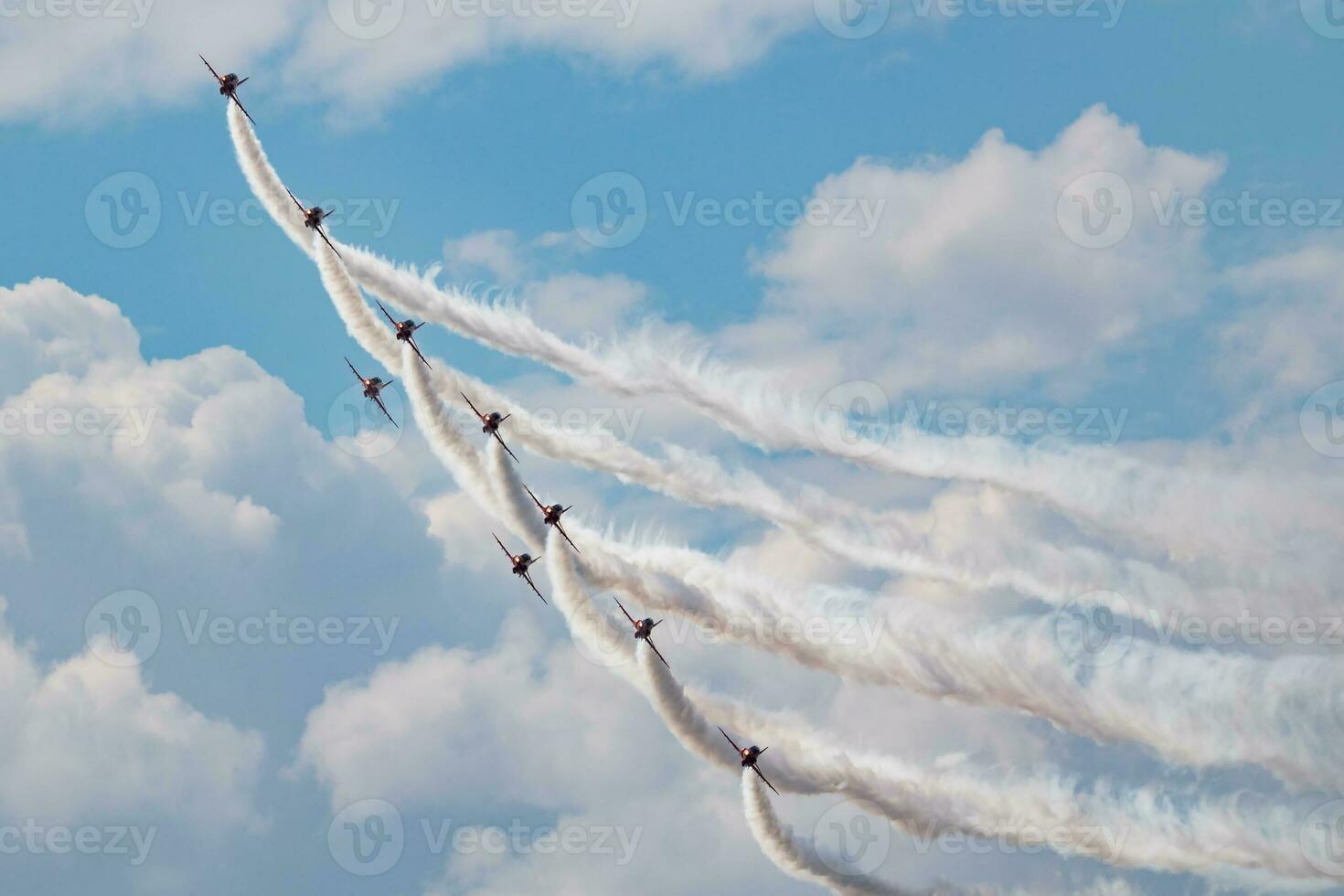 Aerobatic team at airshow. Flight demonstration and formation flying. Air force and military show. Airport and air base. Aviation and aircraft. Fly and flying. photo