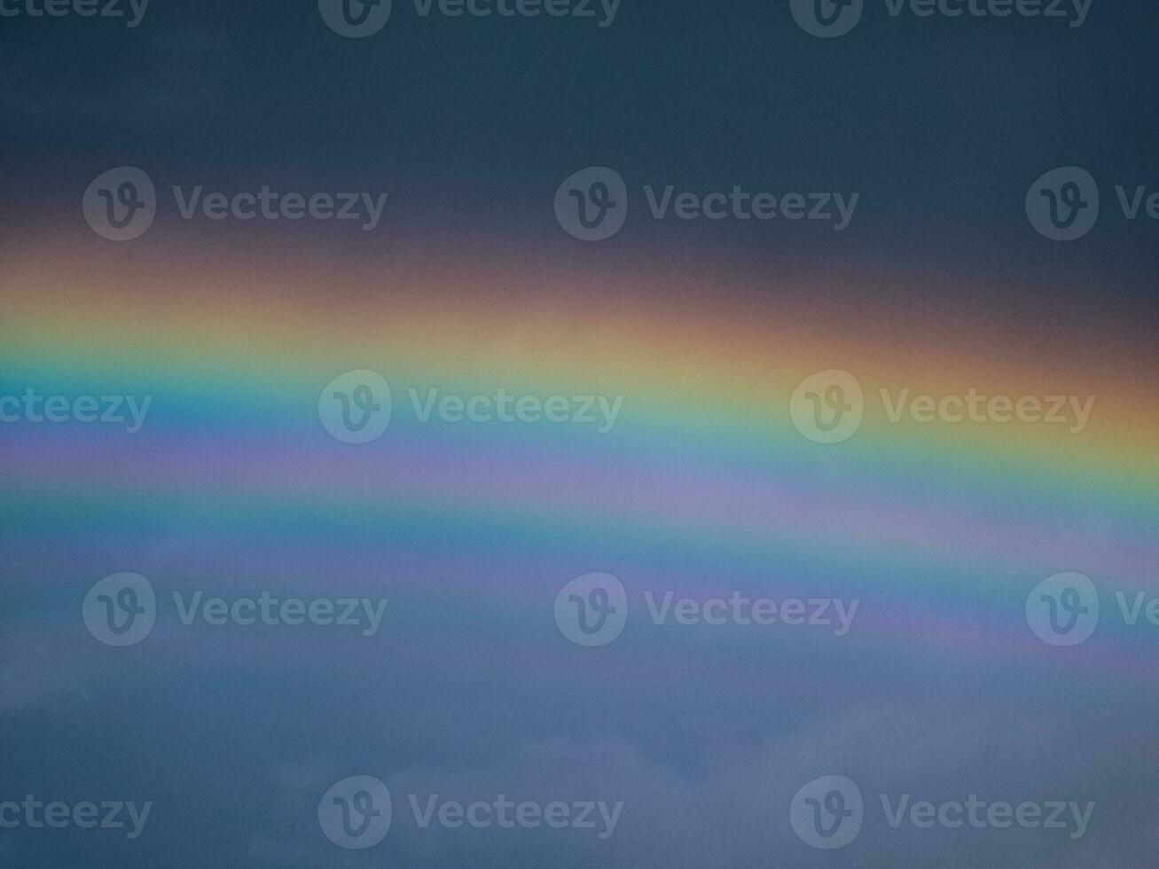 View of a rainbow in a cloudy sky. Double rainbows are a rare phenomenon. photo