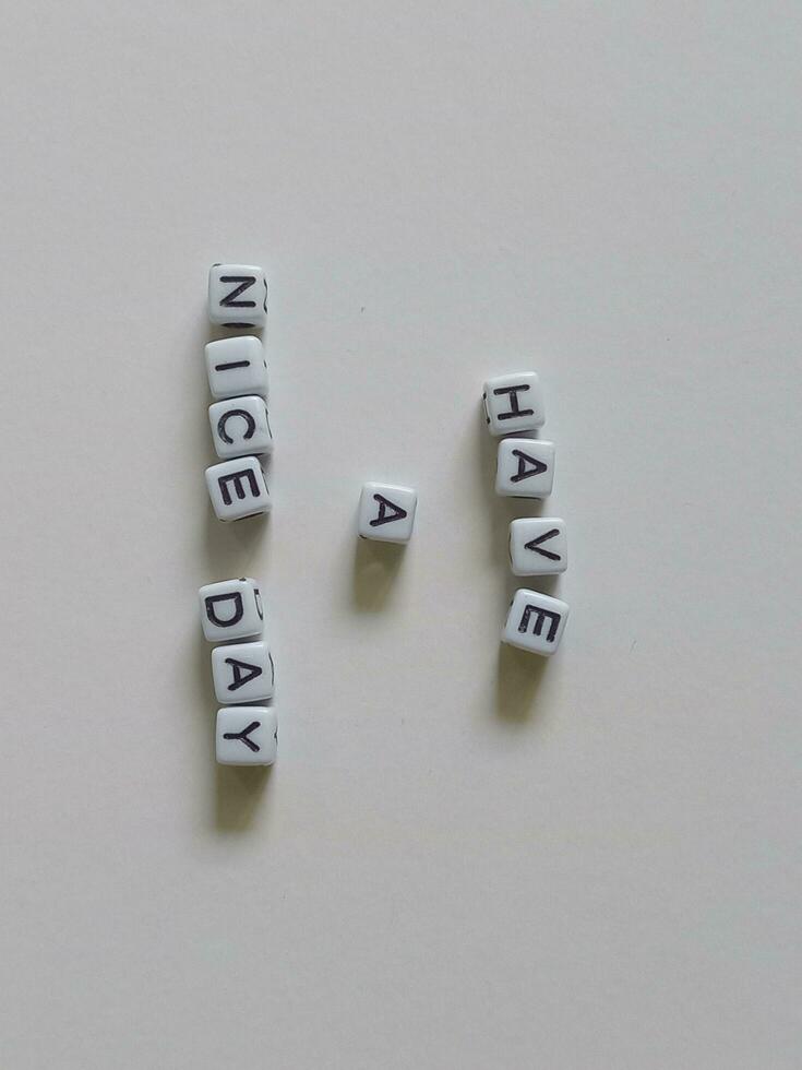 Have a nice day greeting text using alphabet beads photo