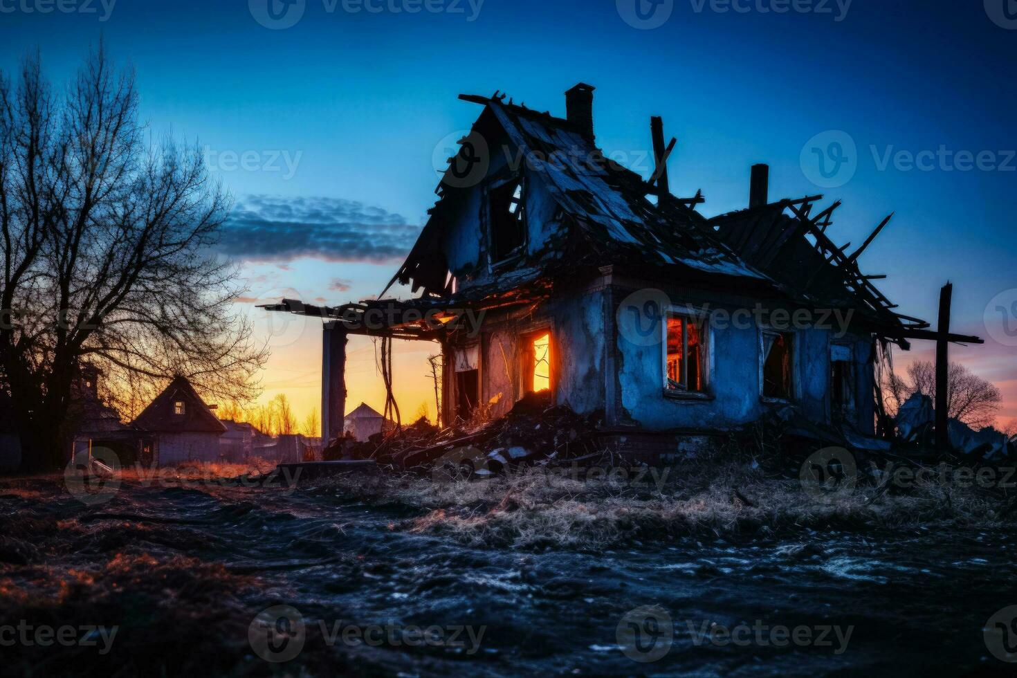 Decrepit old residential house in ruins isolated on a gradient twilight background photo