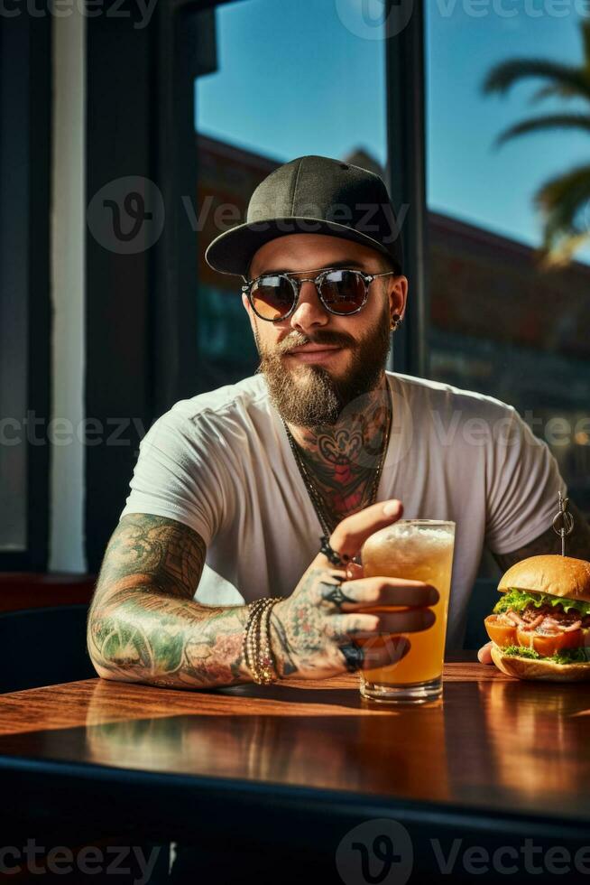 Hipster man relishing a craft burger at rooftop bar isolated on a gradient background photo
