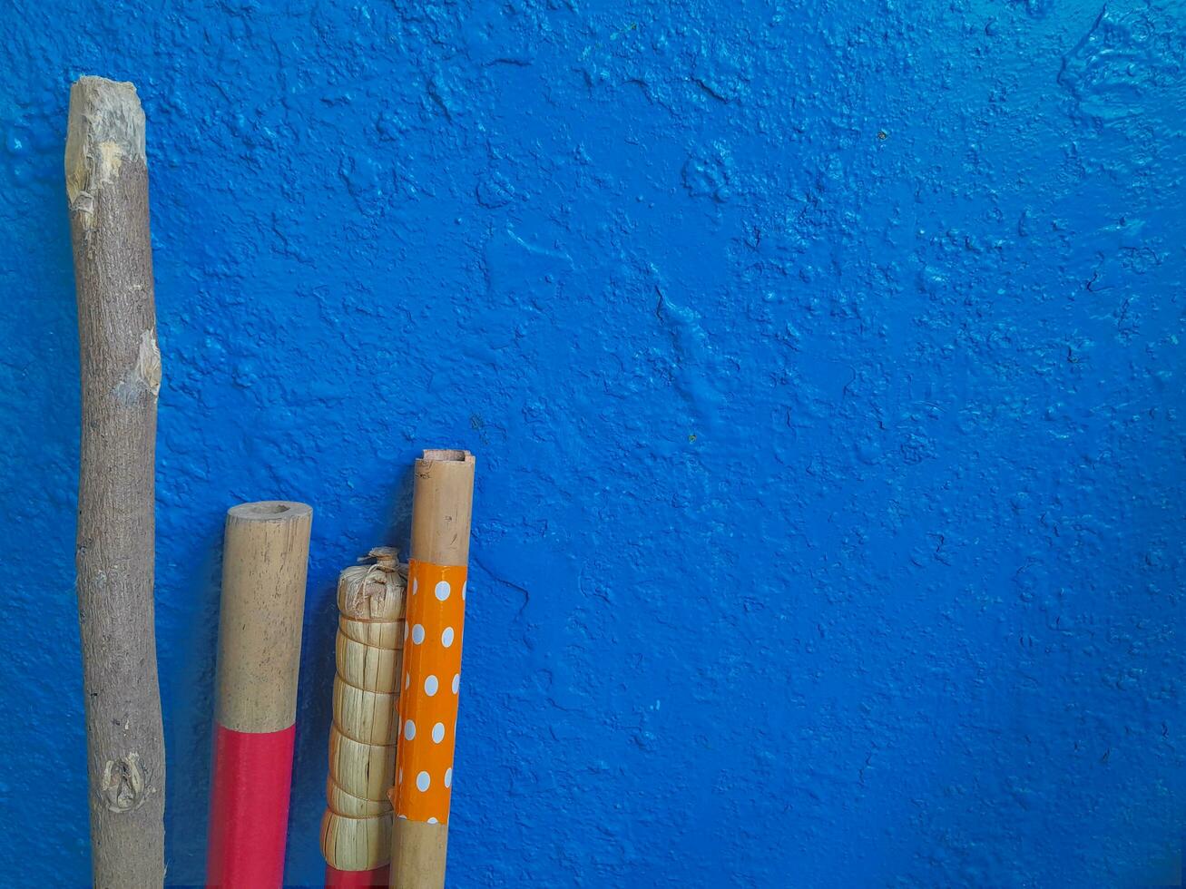 Wood and blue paint on the wall. Copy space for text photo