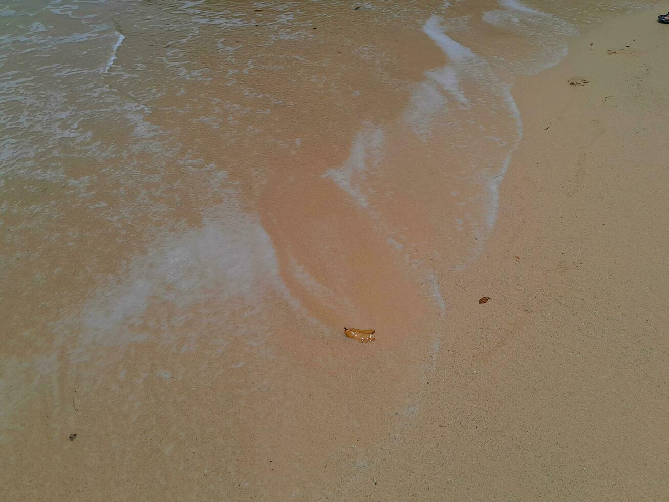 Texture of the sand on the East Java beach photo