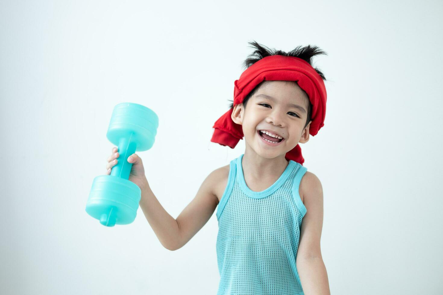 Asian boy in tank top doing exercise And there was a sweat towel on his head. photo