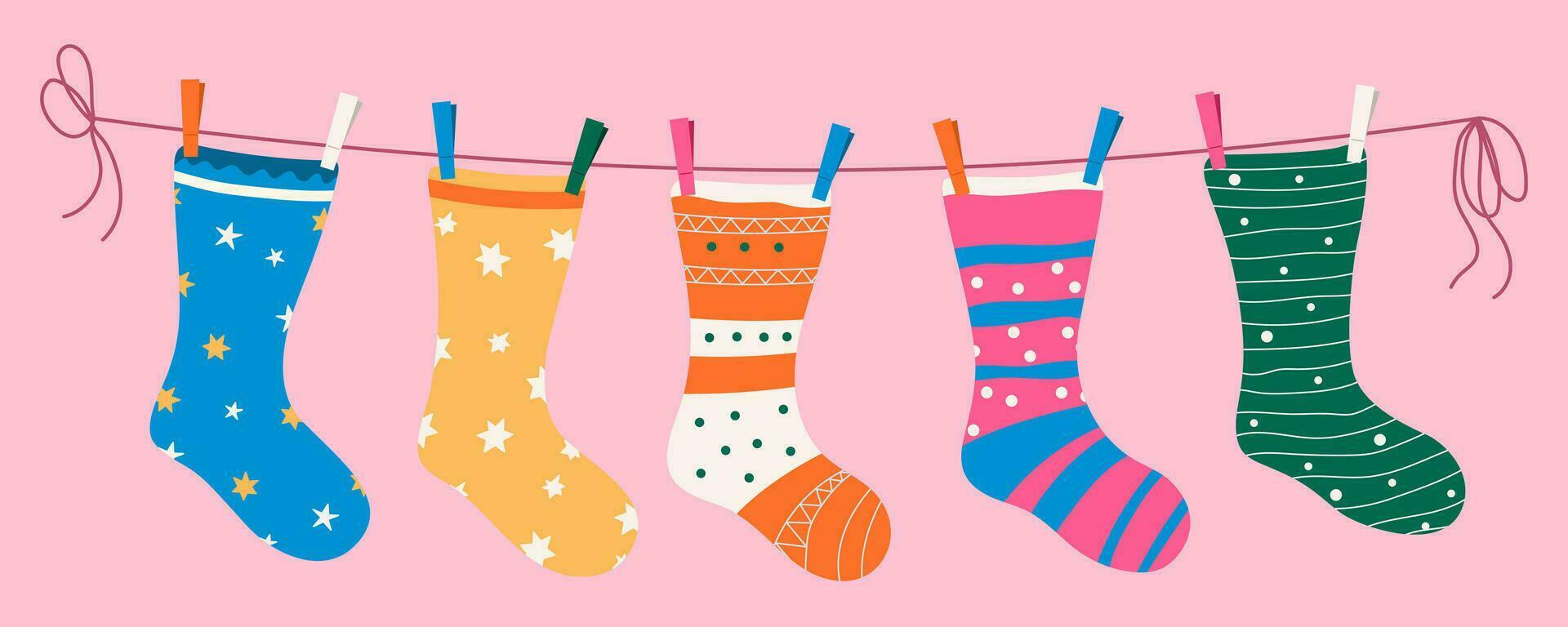 Socks with textures and patterns on a rope with colored clothespins. Vector illustration