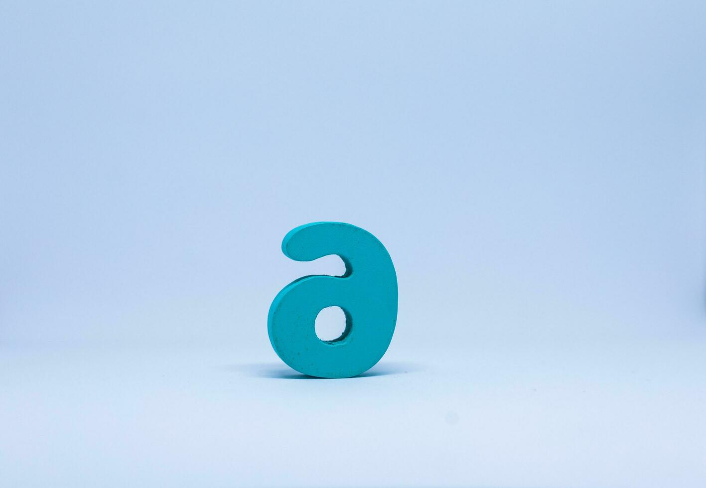 Blue number nine on a white background. photo