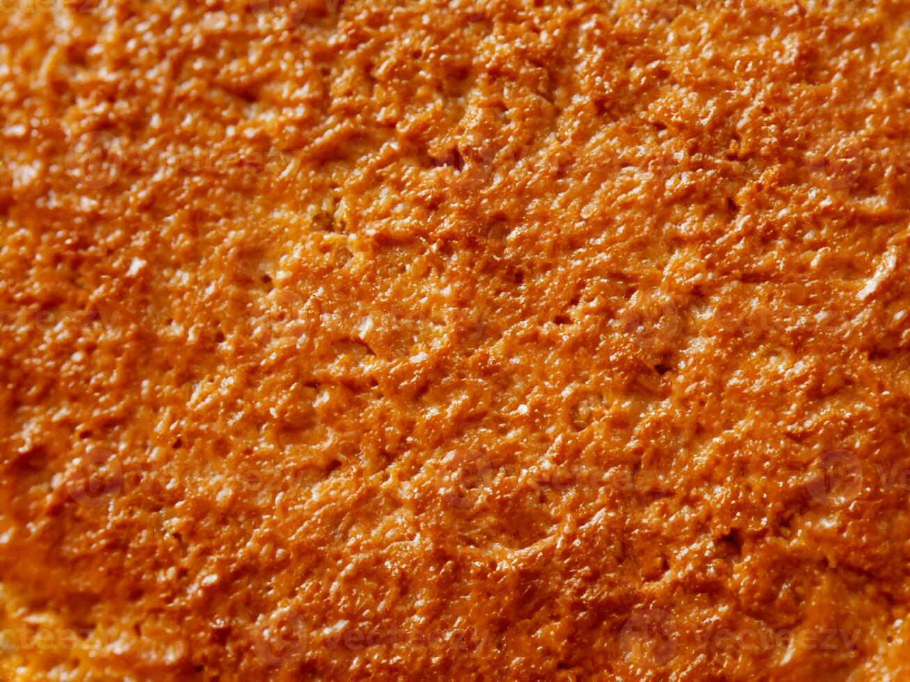 texture of the orange sponge cake, closeup photo