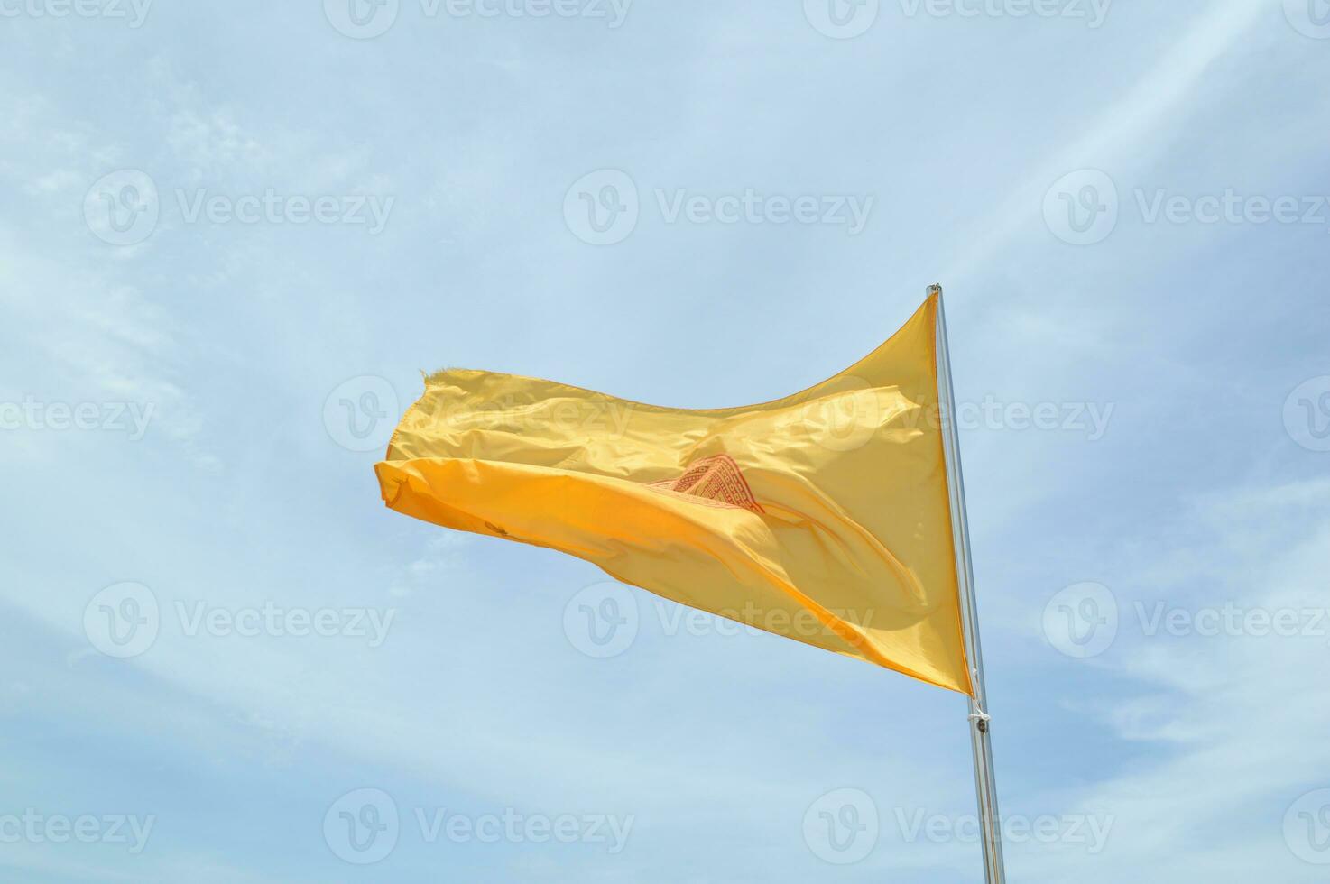yellow flag in the sky photo