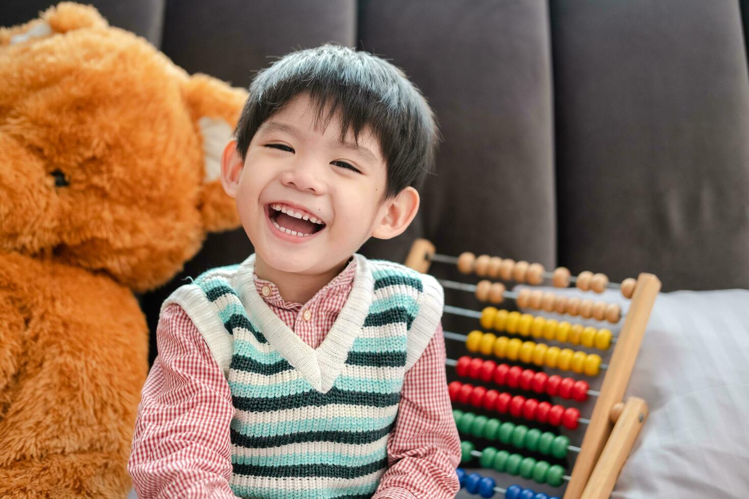 Asian Boy Smiling And Laughing Happily Lying On Bed 32484531 Stock asian-boy-smiling-and-laughing-happily-lying-on-bed-32484531-stock