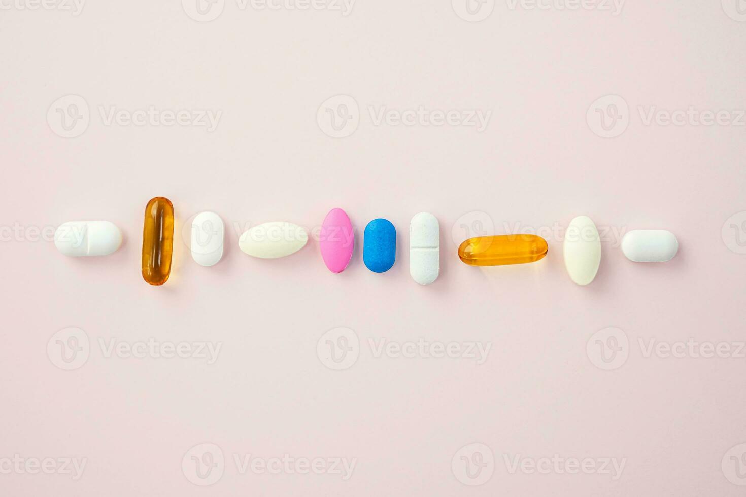 Some various pills, vitamin capsules layout. photo