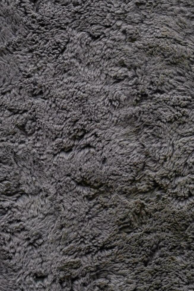 Fluffy carpet surface. Soft rug material close up. photo