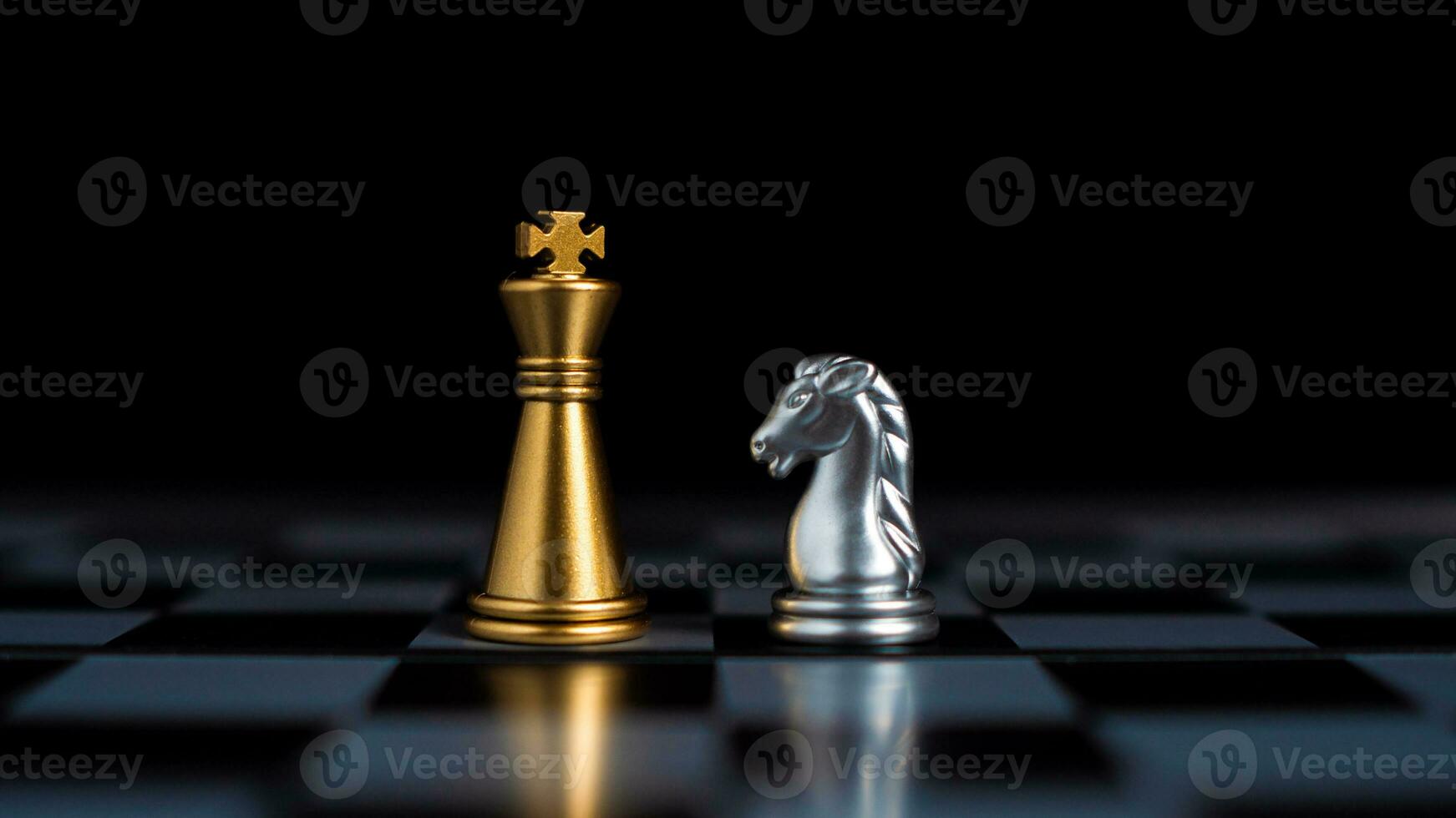 Gold and silver chess pieces in chess board game for business comparison. Leadership concepts, human resource management concepts. photo