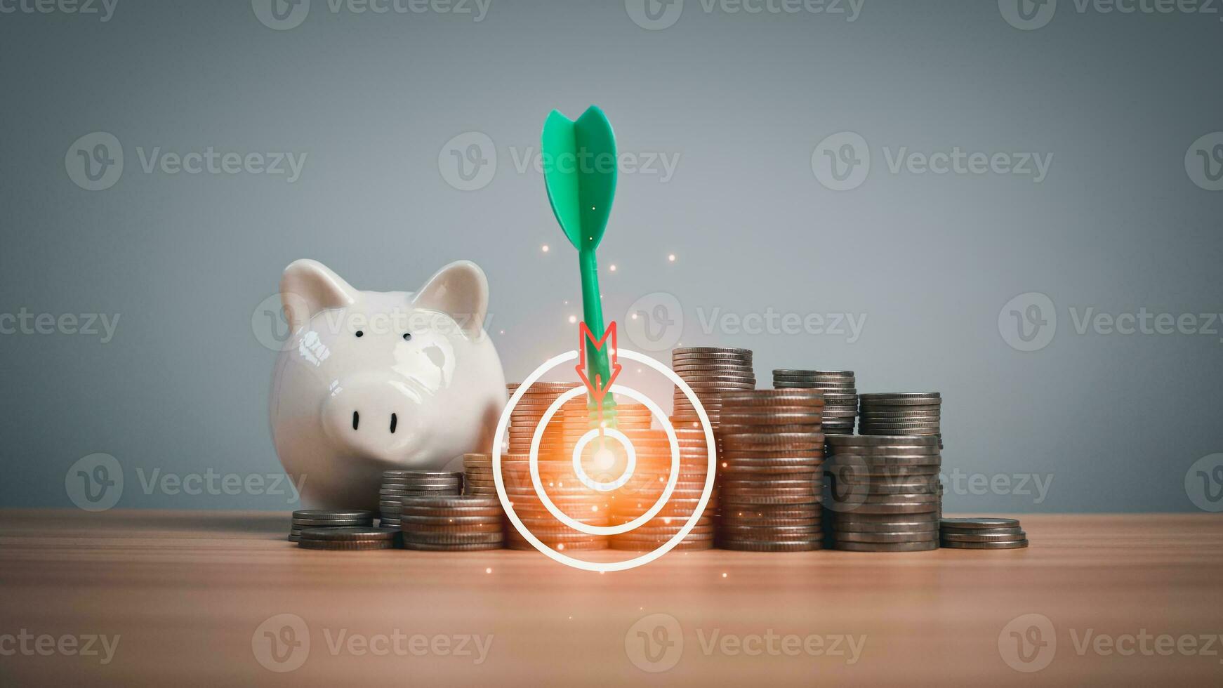 Piggy bank and coins lined up on a wooden background with target icons on a white background. Financial concepts, savings and investments photo