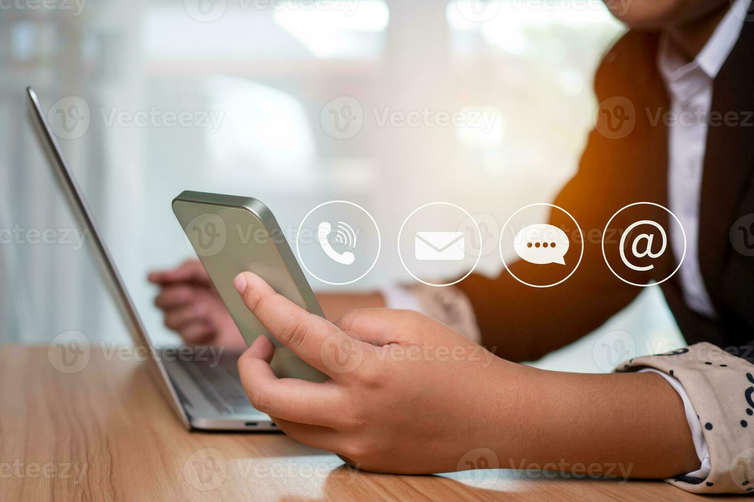 Website page, contact us or email marketing concept, customer support hotline, contact us. Businesswoman sitting and working on computer. Email, phone, address, chat message icon. photo