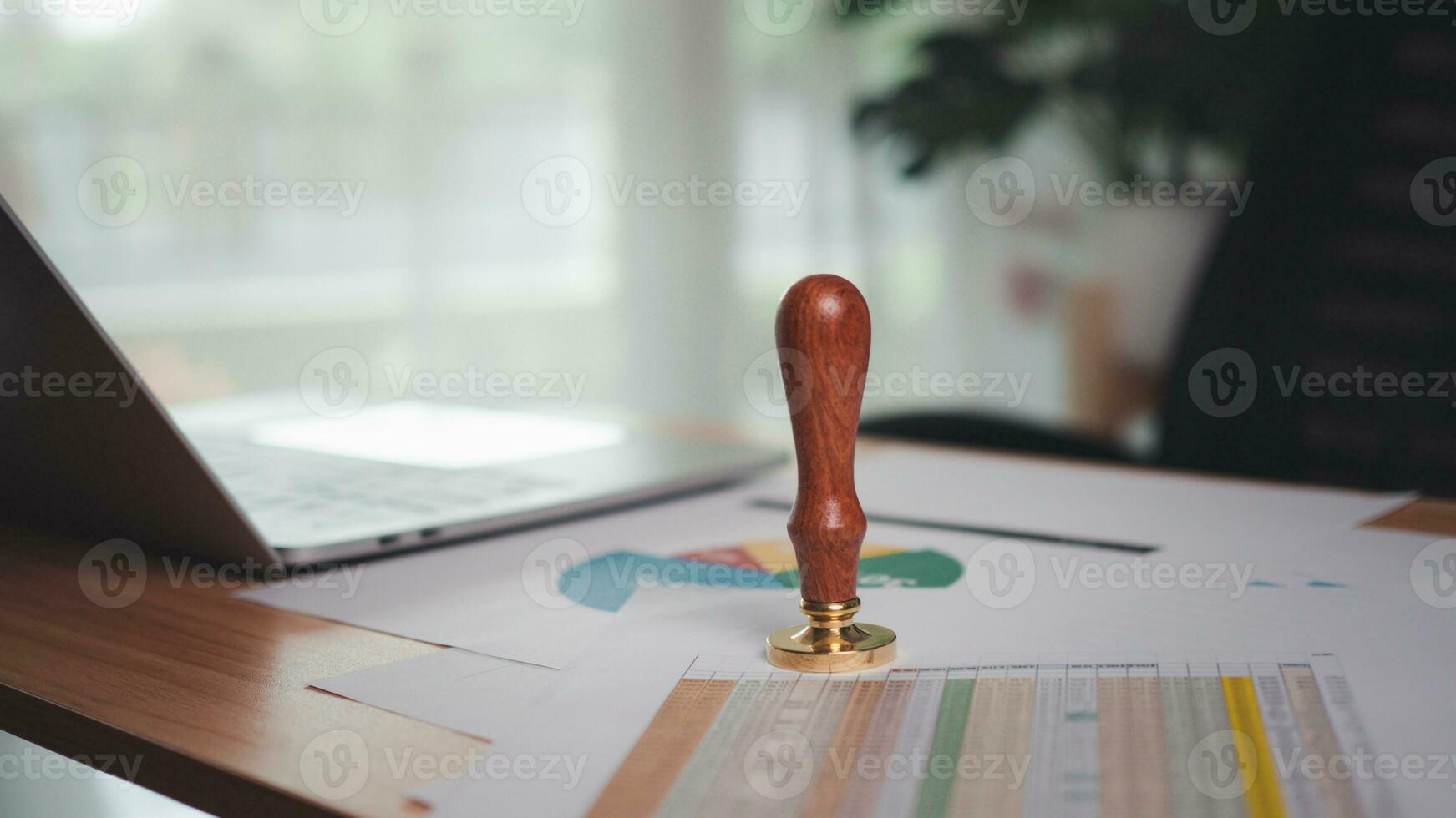 The company seal was placed on the desk. Stamping to document approve and reject project, Signing a business contract approval of contract documents confirmation, approval stamp, copy space. photo